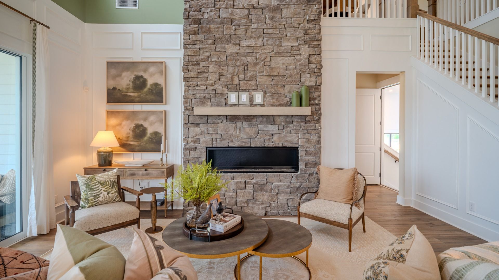 Gathering room with fireplace and access to rear porch