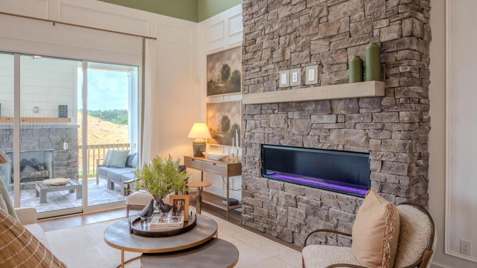 Gathering room with fireplace and access to rear porch