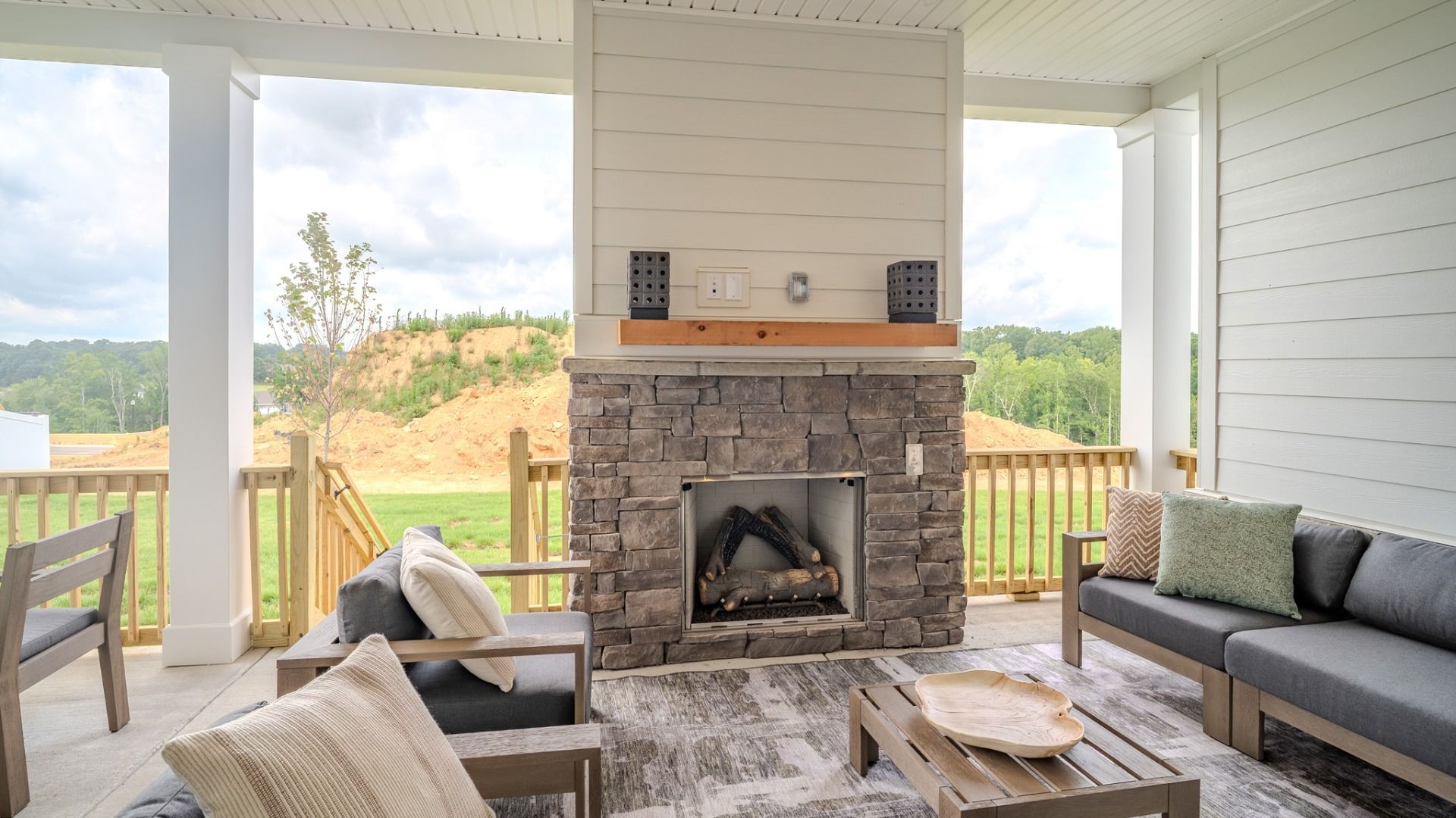 Spacious rear covered patio with fireplace