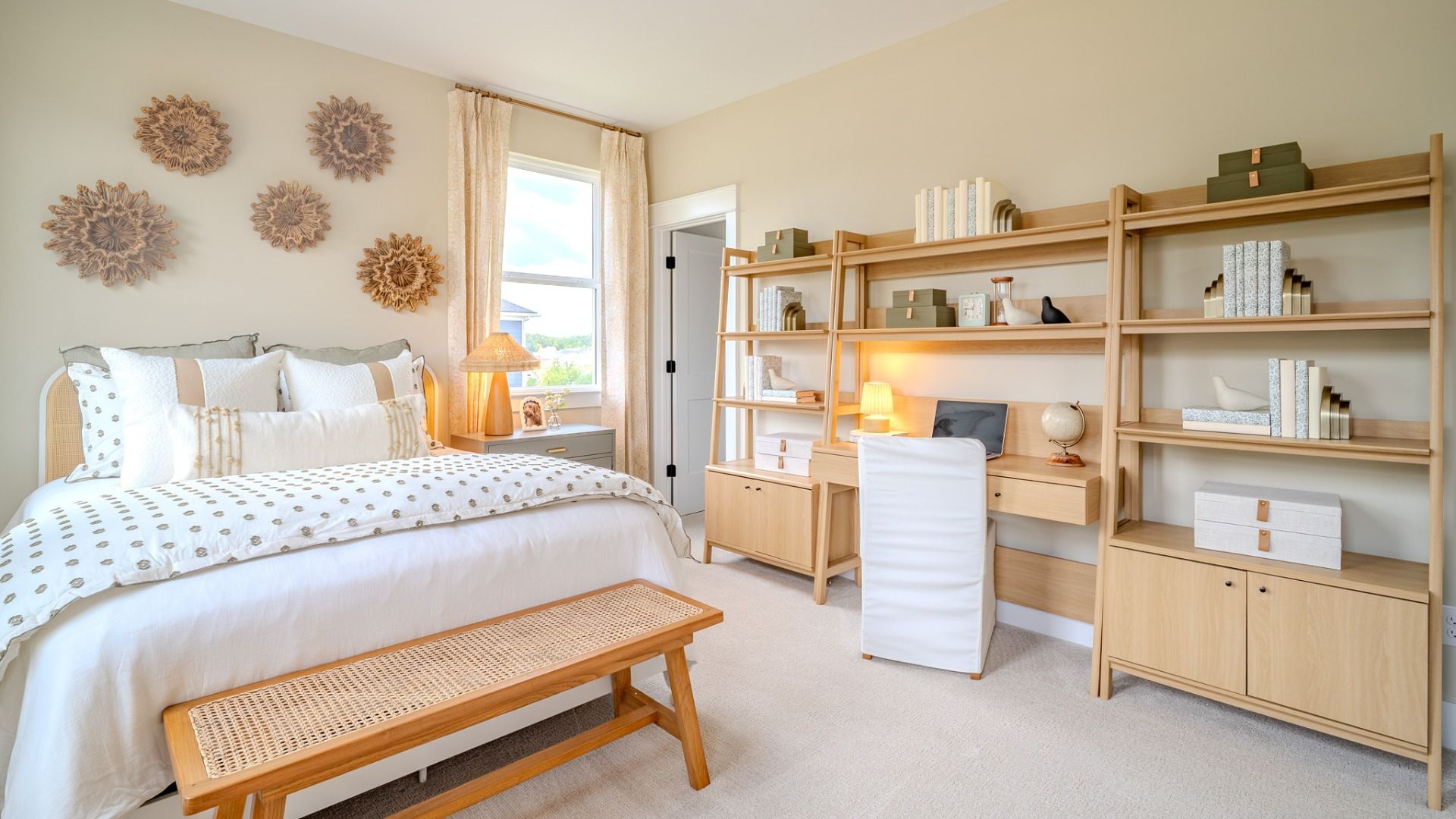 Secondary bedroom with carpet and bright natural light from windows