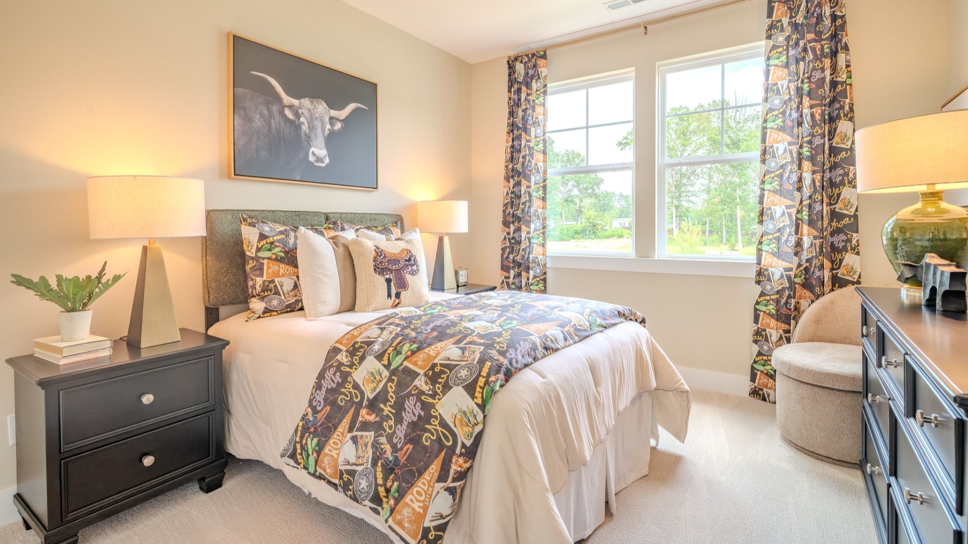 Secondary bedroom with carpet and bright natural light from windows