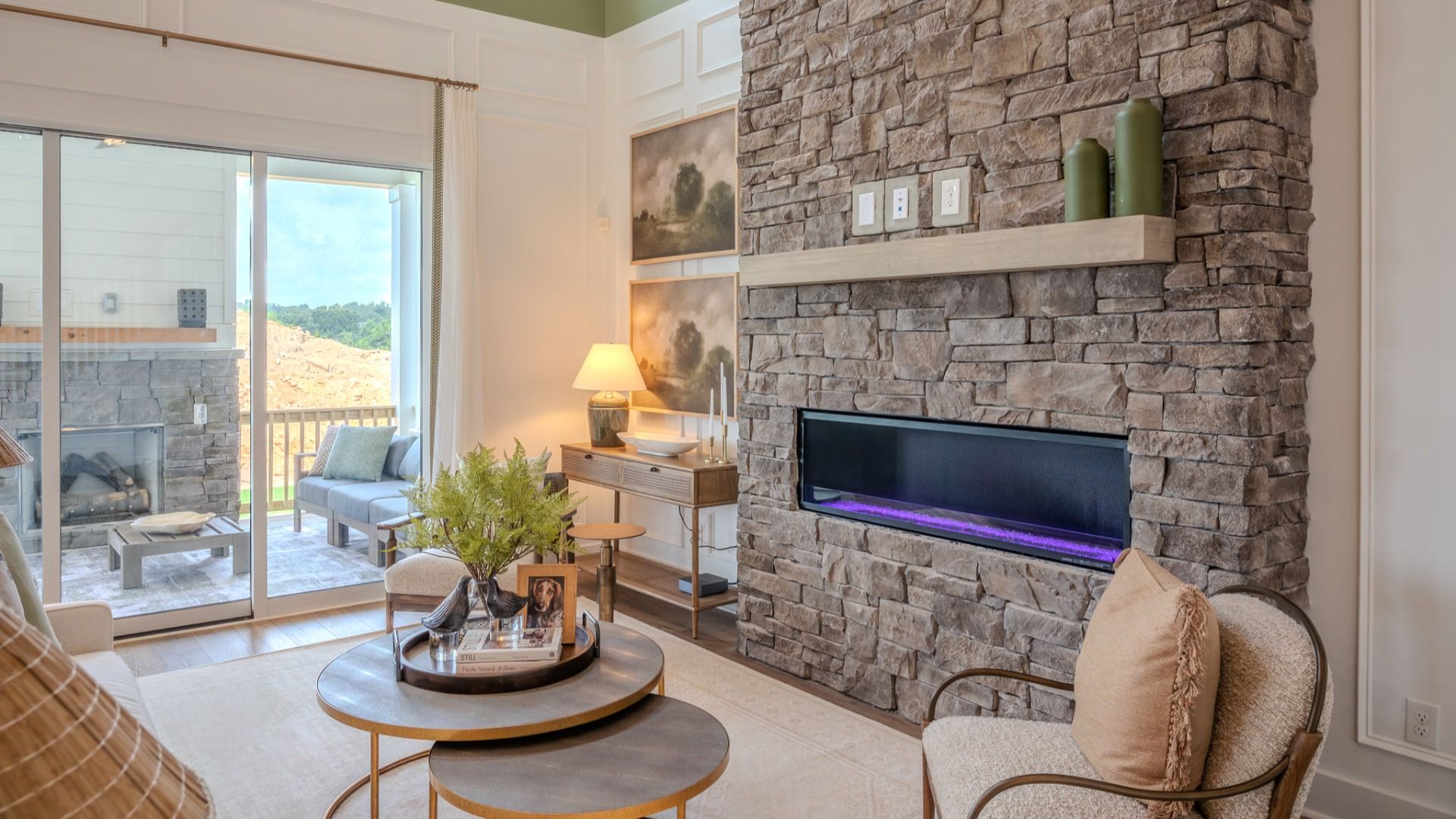Gathering room with fireplace and access to rear patio