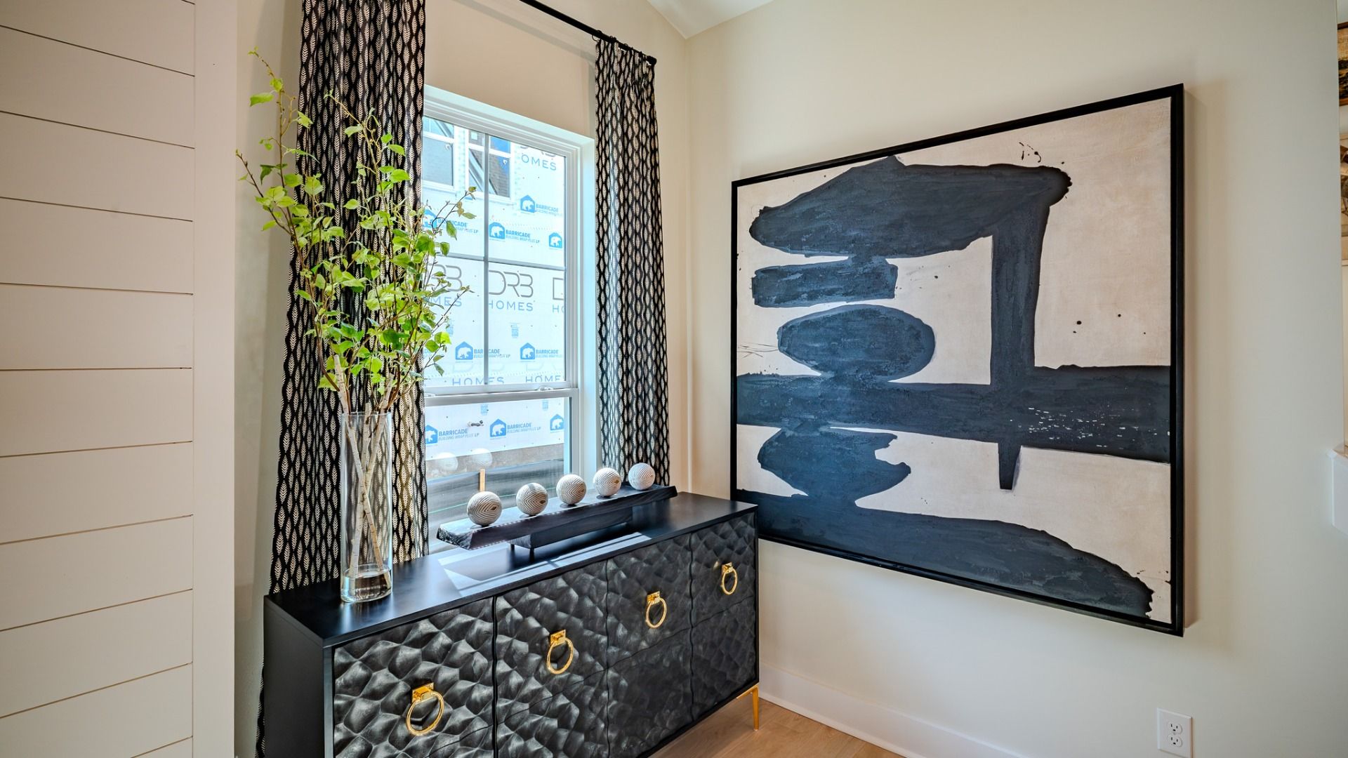 Gathering room with close-up of large window and wall art