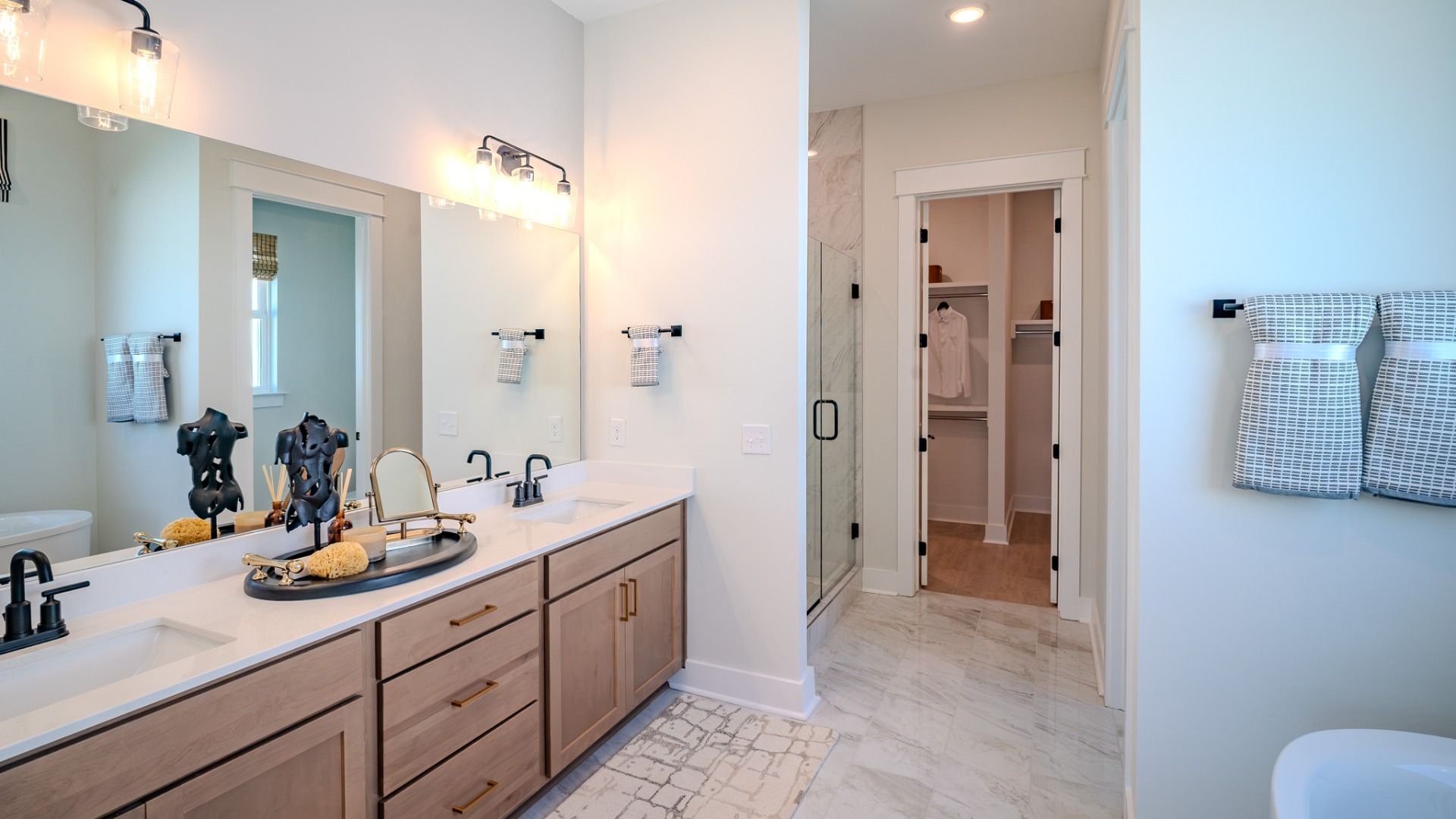 Primary bathroom with dual vanity and soaking tub