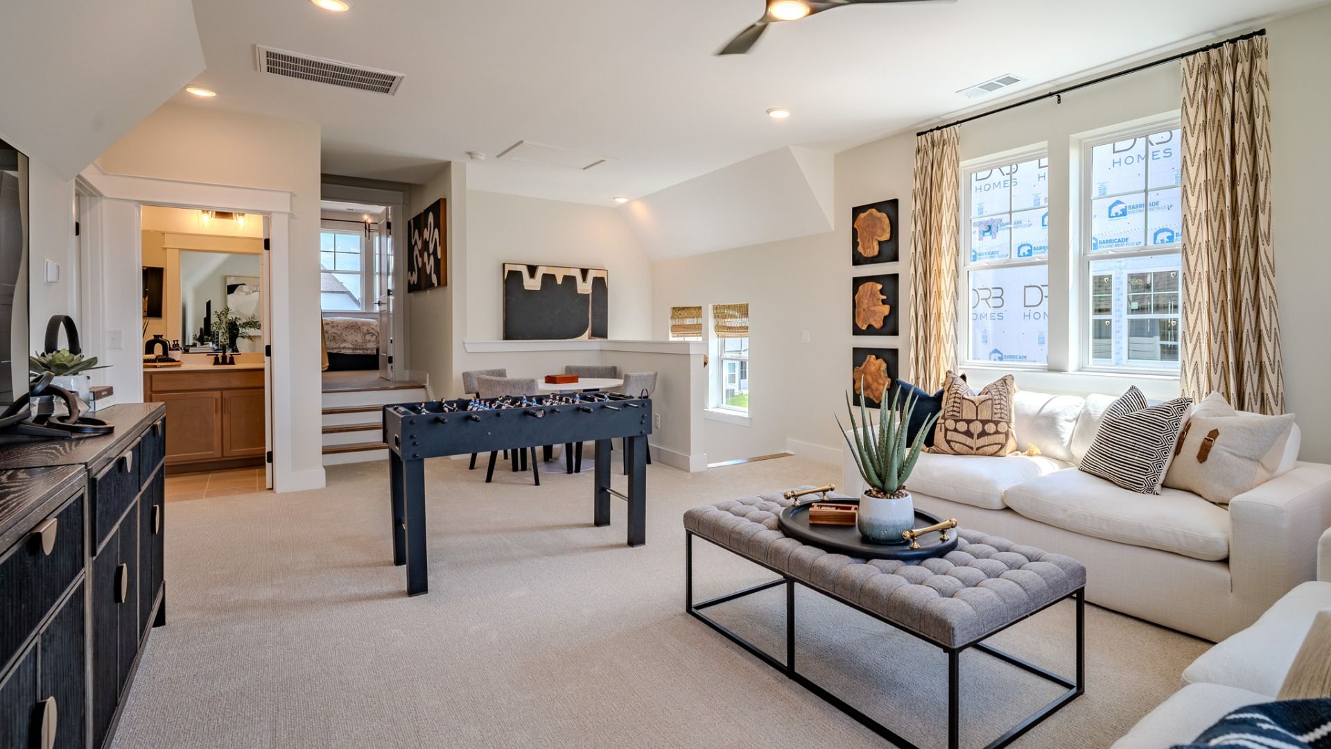 Spacious loft with hard surface flooring and bright natural lighting from windows