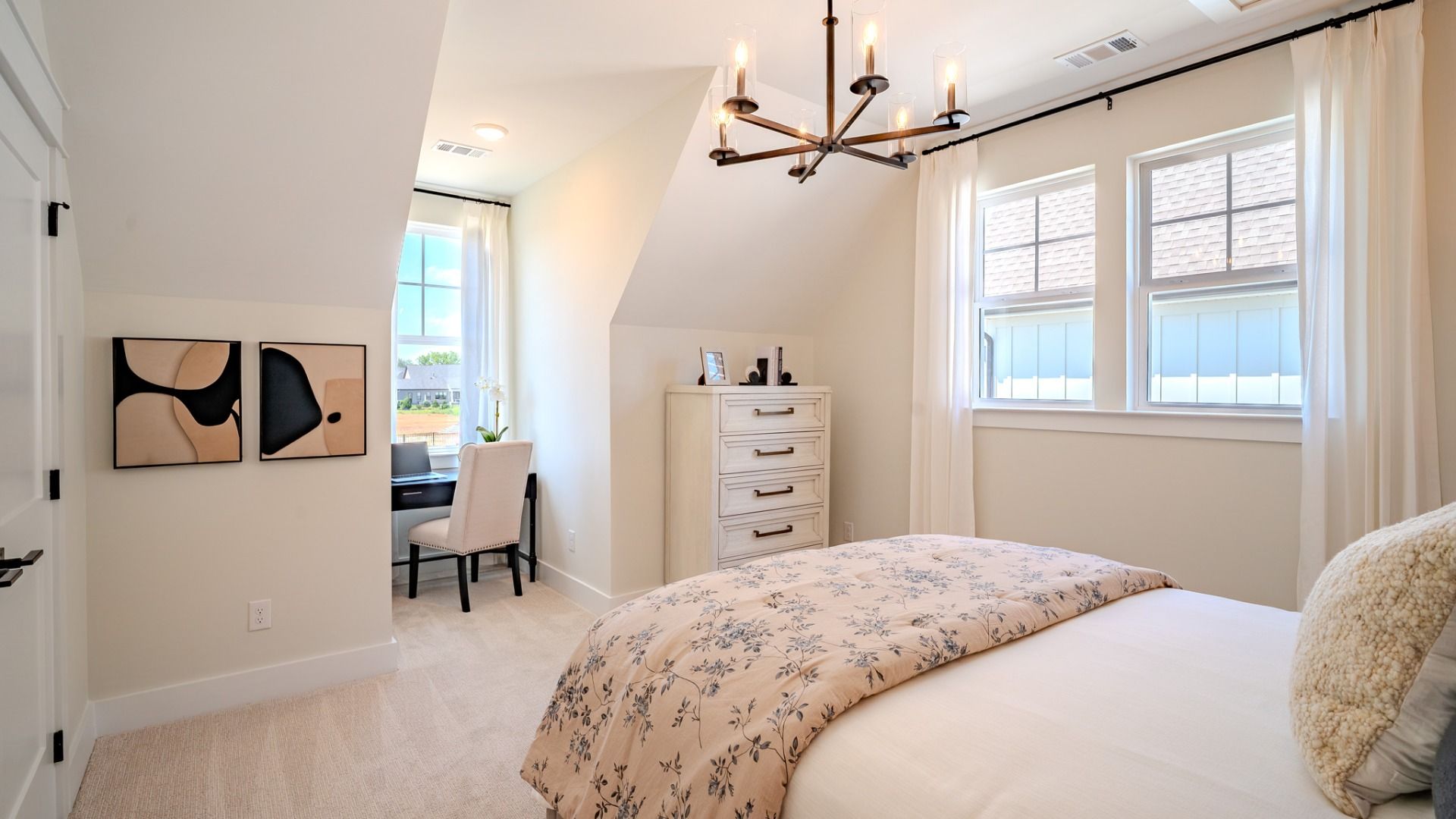 Secondary bedroom with carpet and bright natural light from windows
