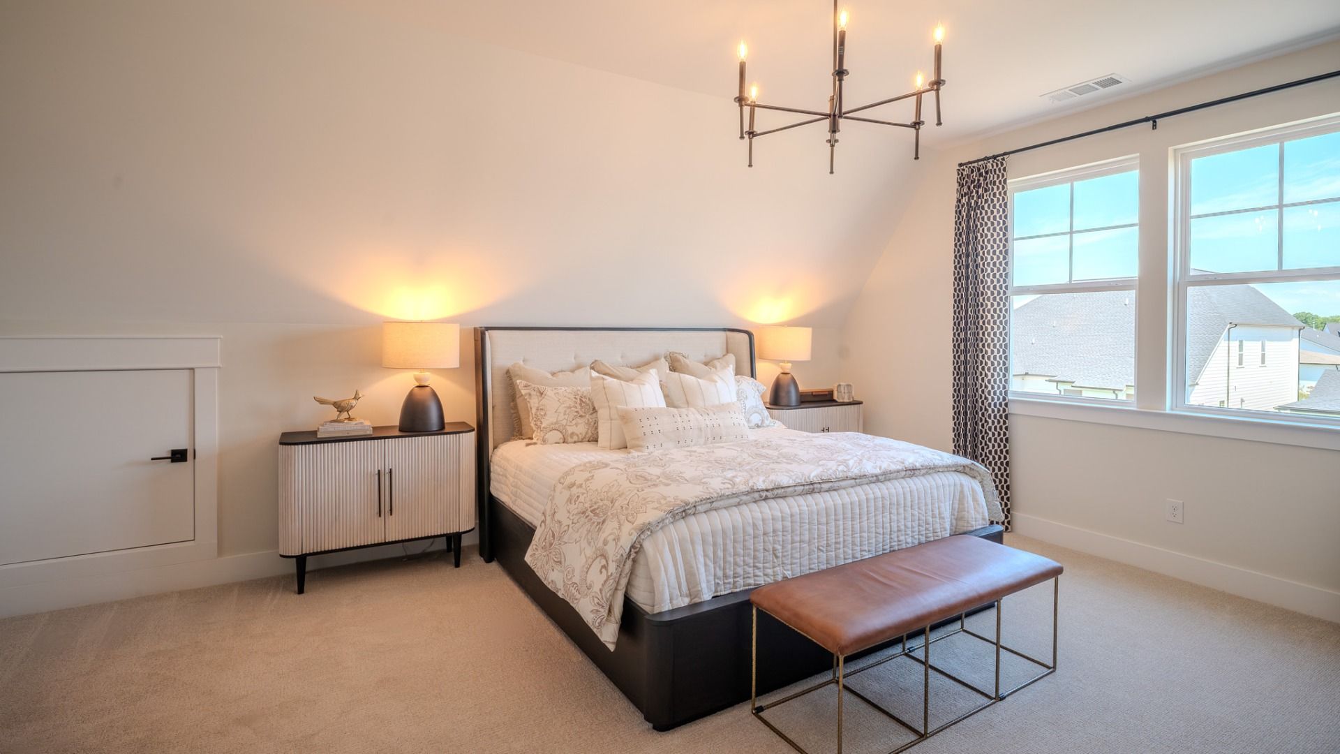Secondary bedroom with carpet and bright natural light from windows