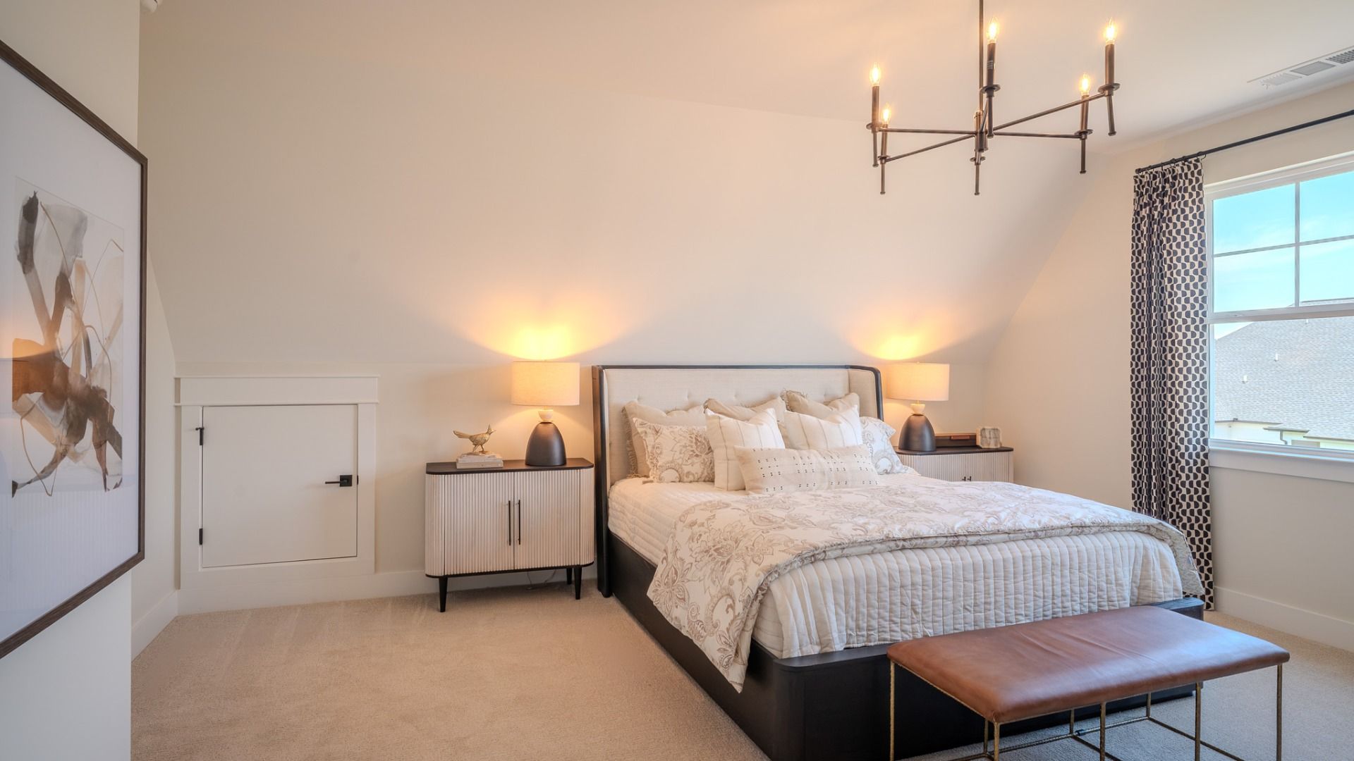 Secondary bedroom with carpet and bright natural light from windows