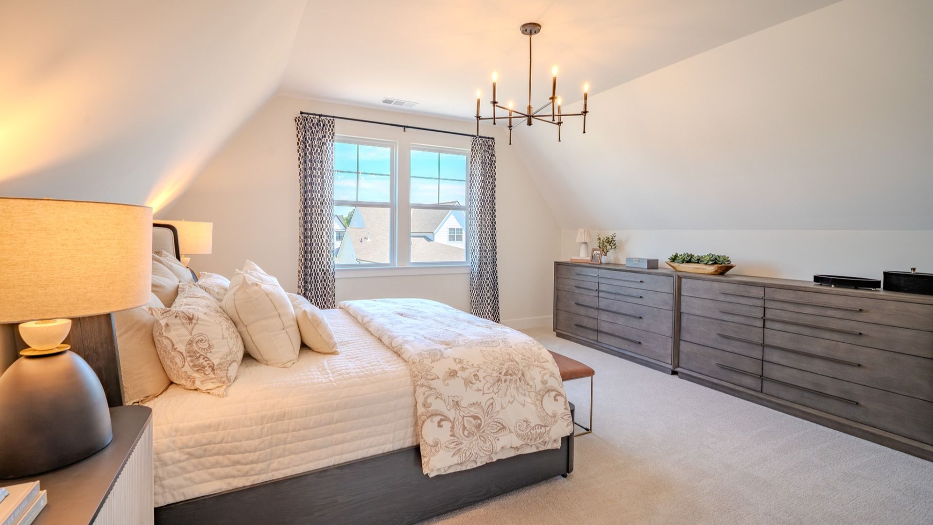 Secondary bedroom with carpet and bright natural light from windows
