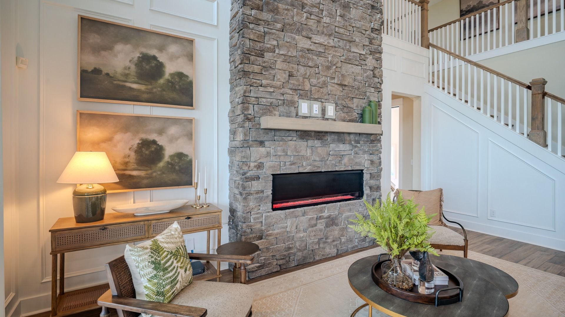 Elate II Gathering room with impressive 2-story fireplace, acting as a centerpiece to the home