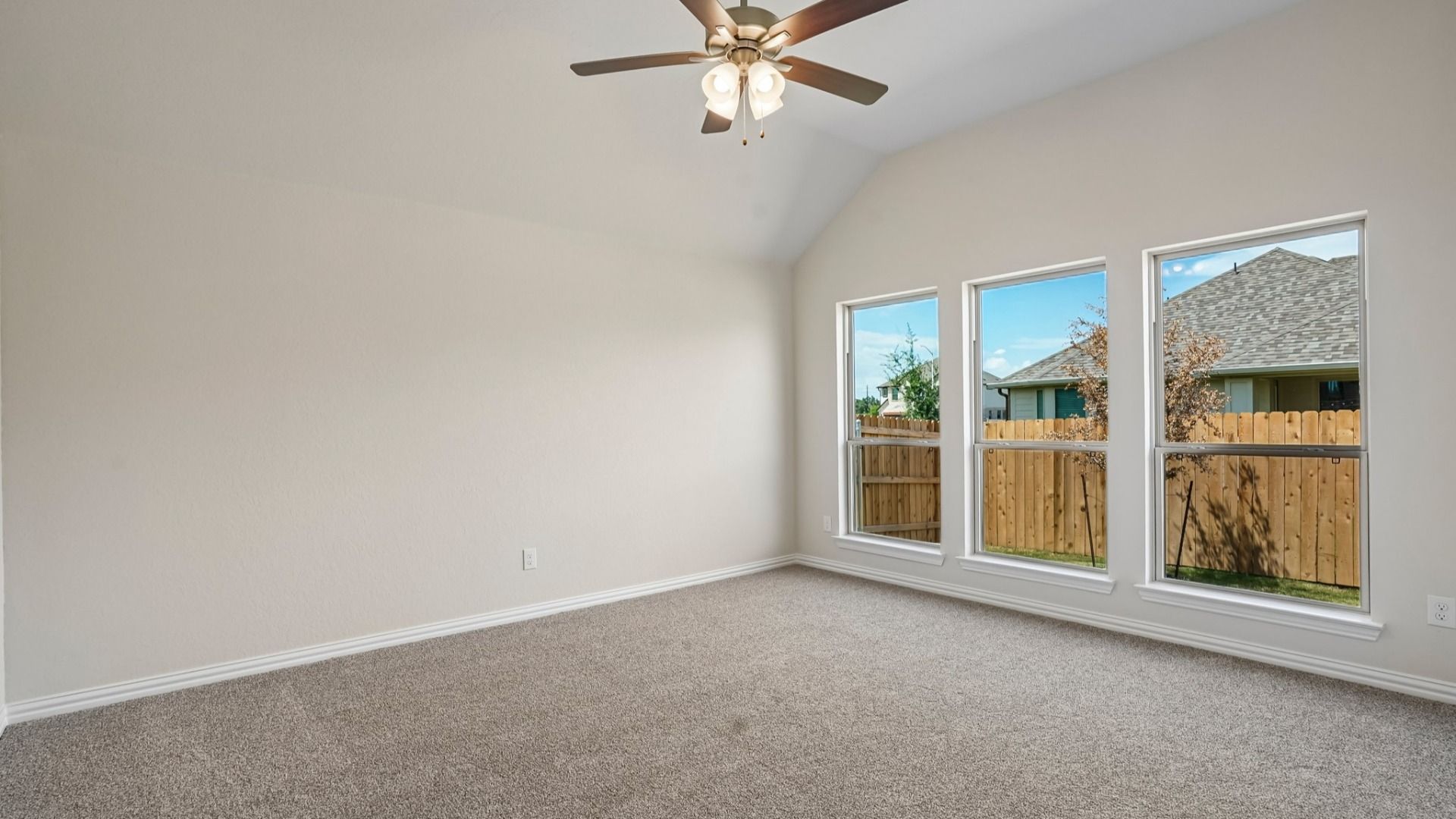 Owner's suite with abundant natural light and peaceful backyard views for a bright, relaxing retreat.