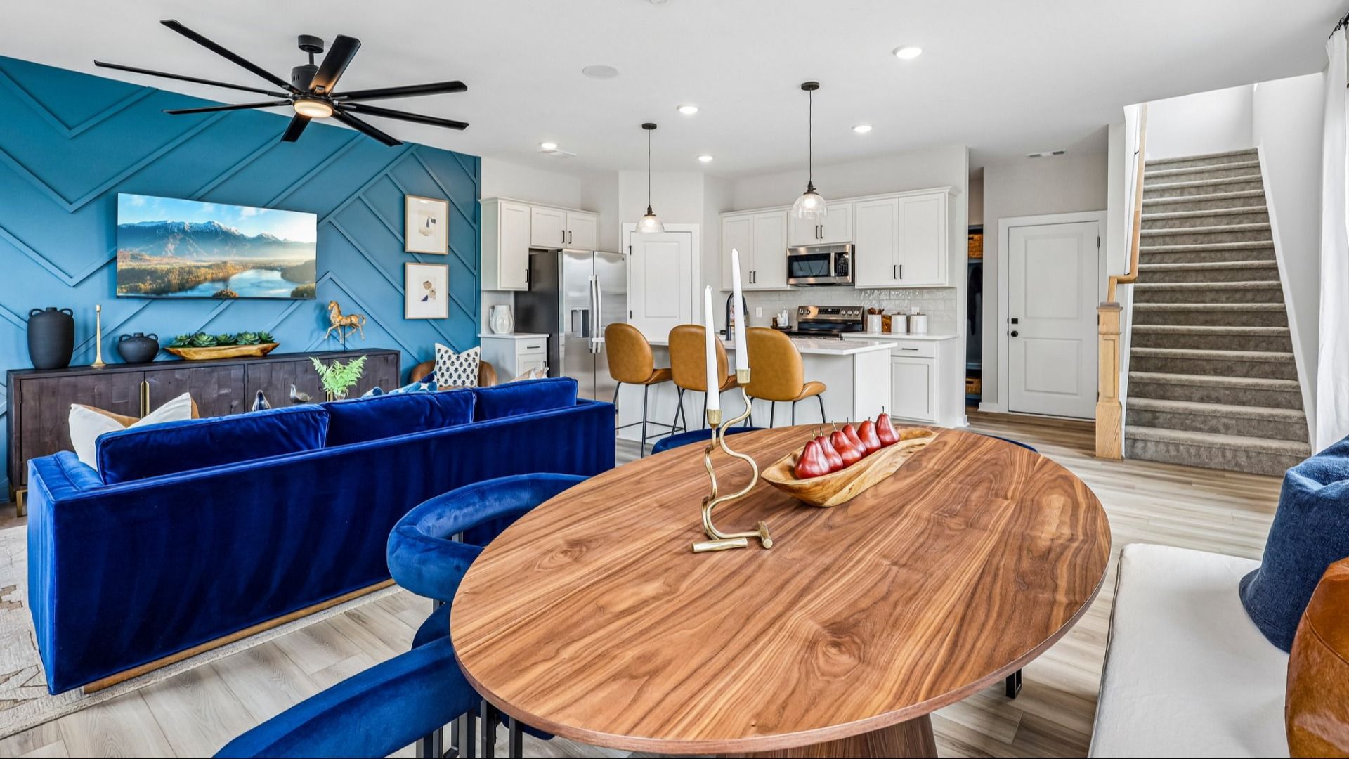 First floor view of gathering room, dining area, and kitchen