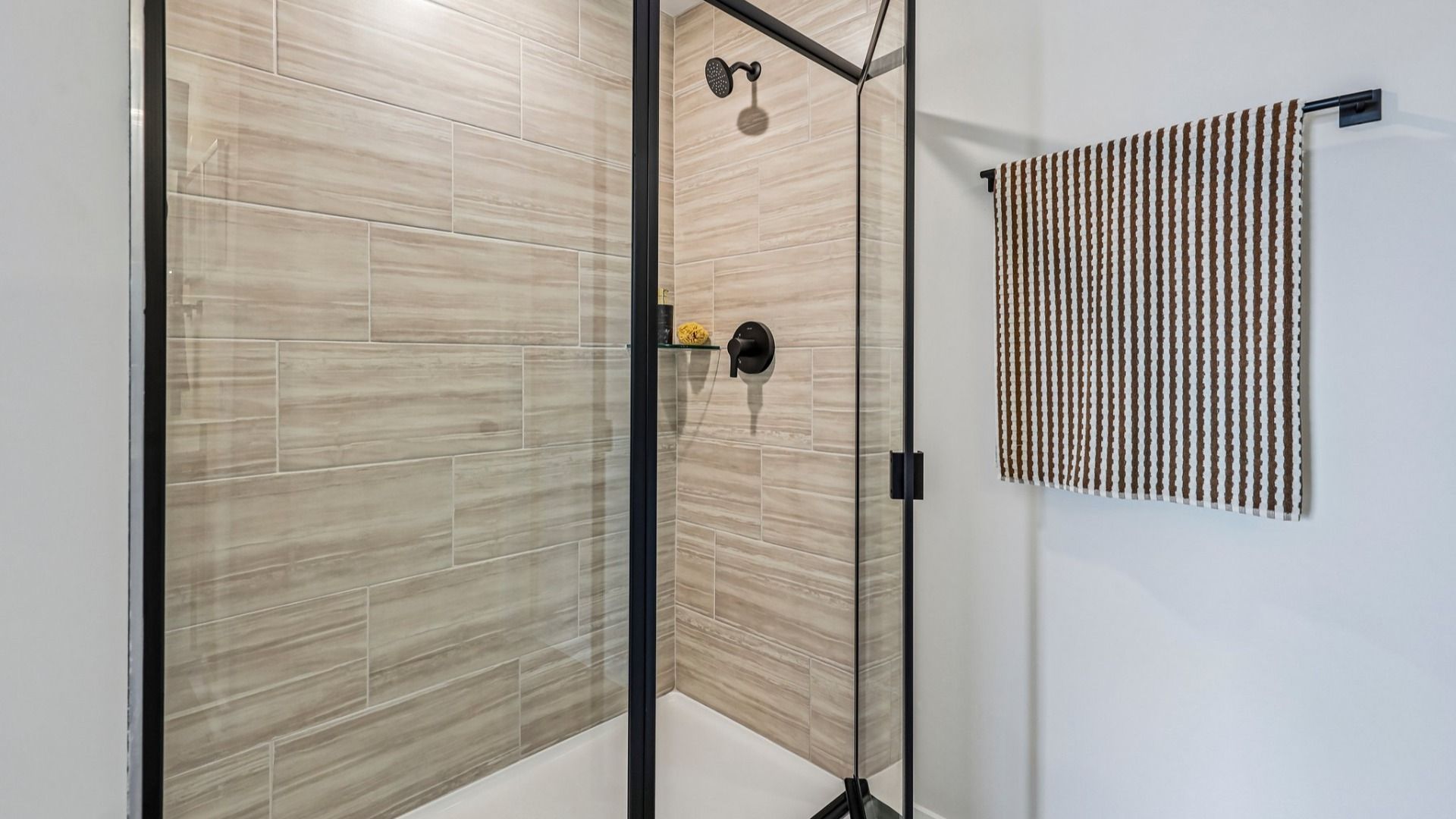 Primary bathroom with glass-enclosed shower