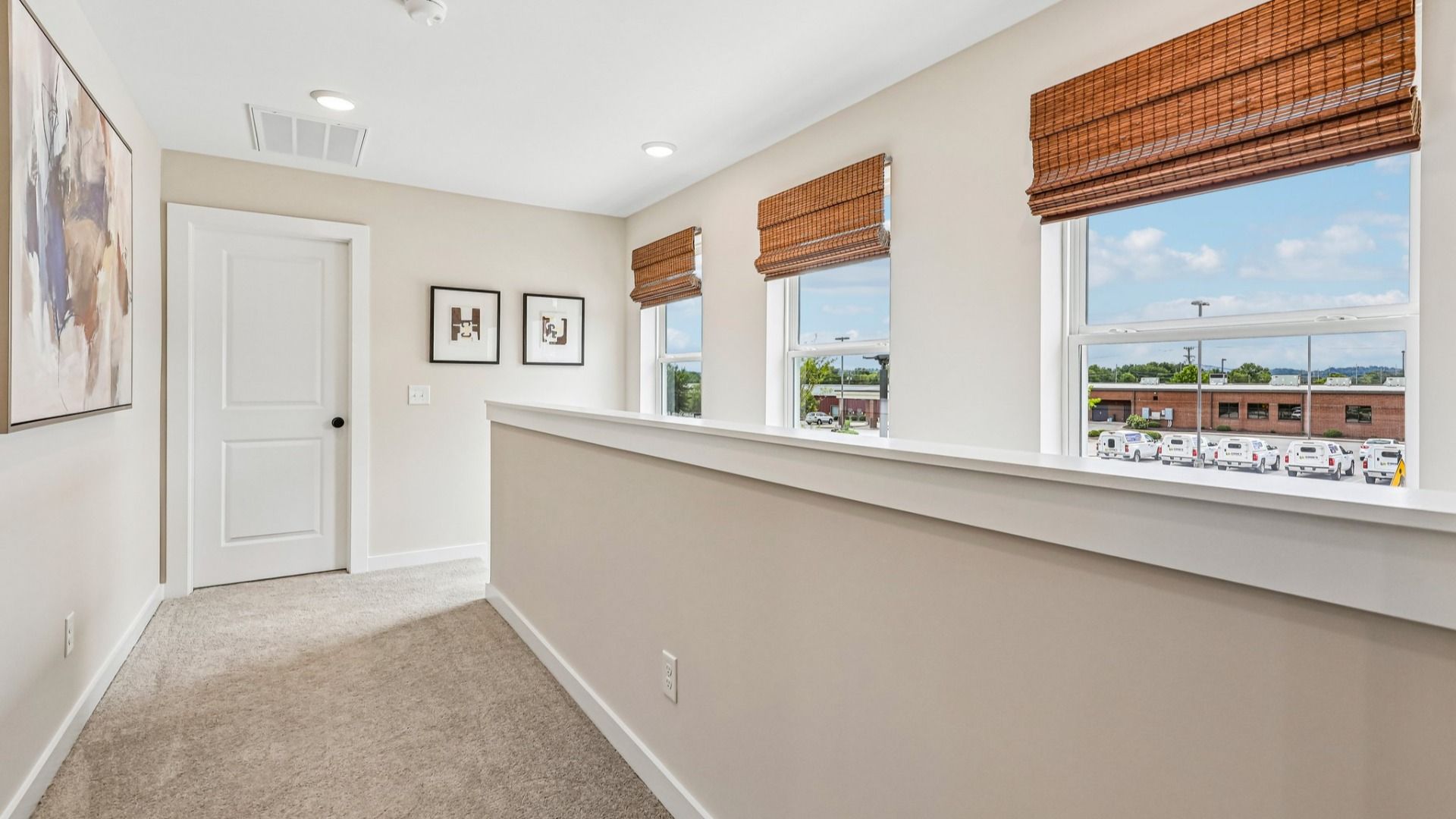 Second Floor Hallway with carpet and access to staircase