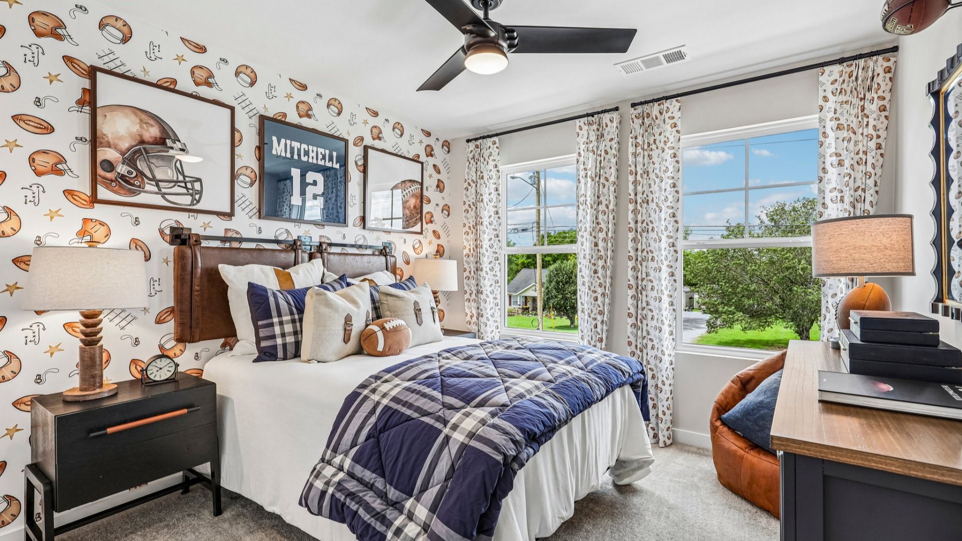 Secondary bedroom with carpet and windows