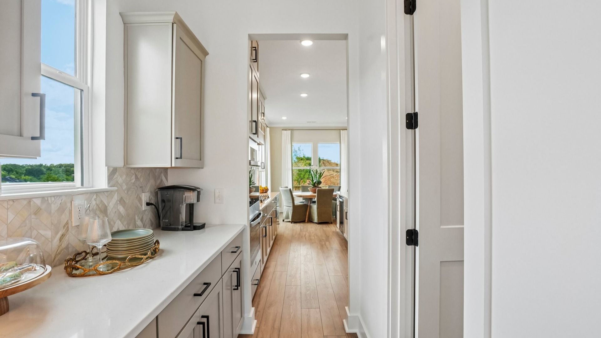 Portion of kitchen with additional counter space and access to walk-in pantry