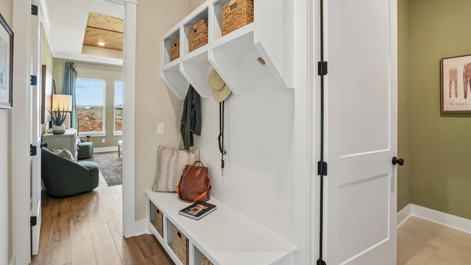 Dedicated drop-zone with access to laundry room and primary suite
