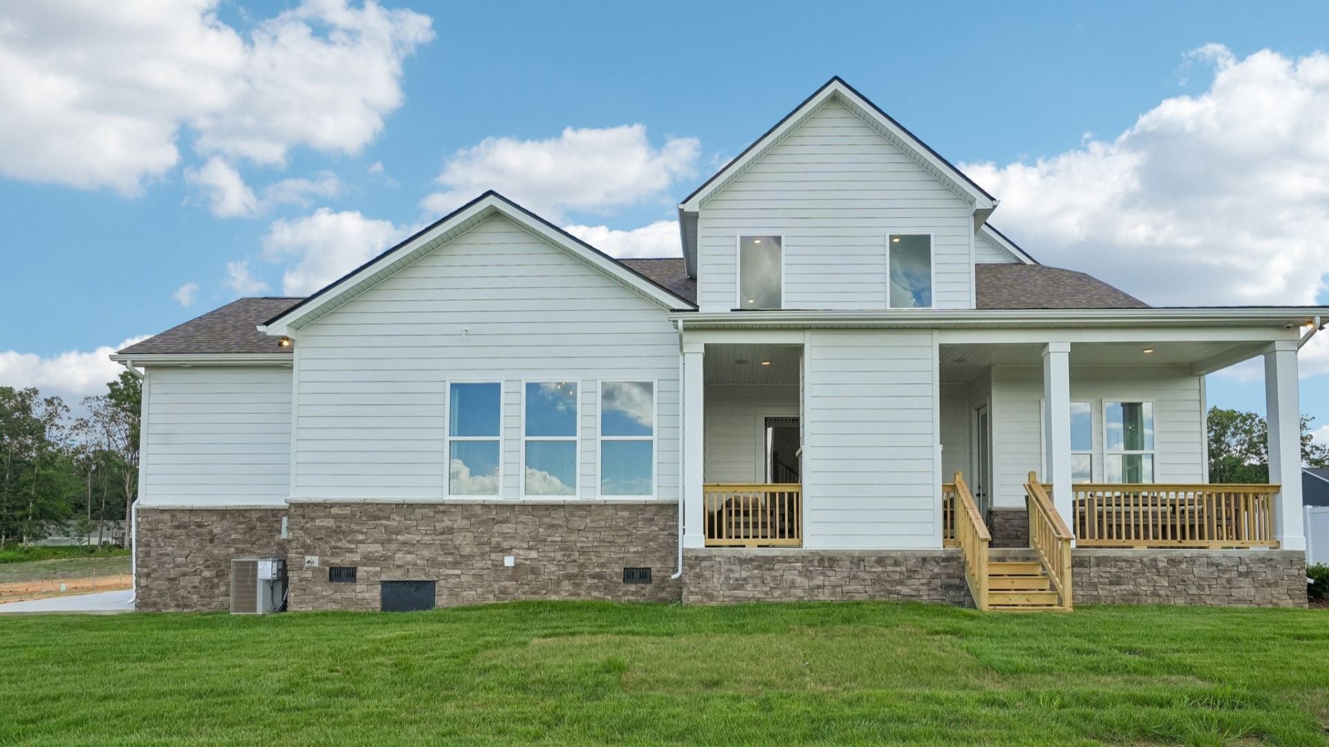Rear exterior with view of large, covered porch