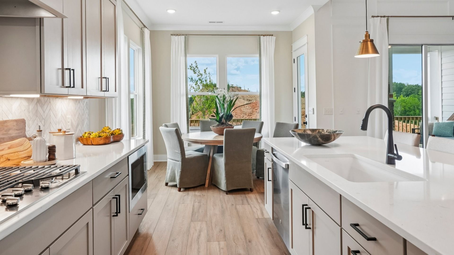 Kitchen with view of cafe area and rear entryway