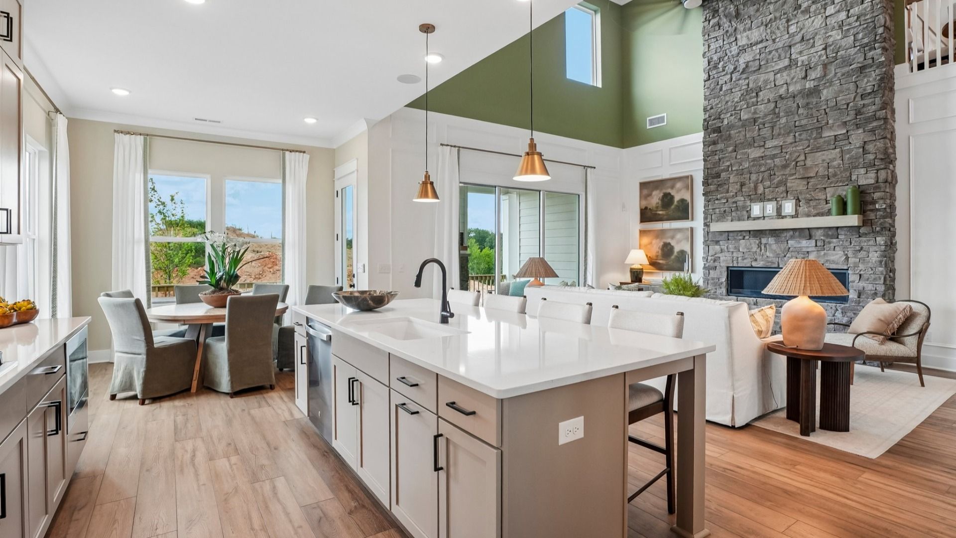 Kitchen with view of cafe area and gathering room