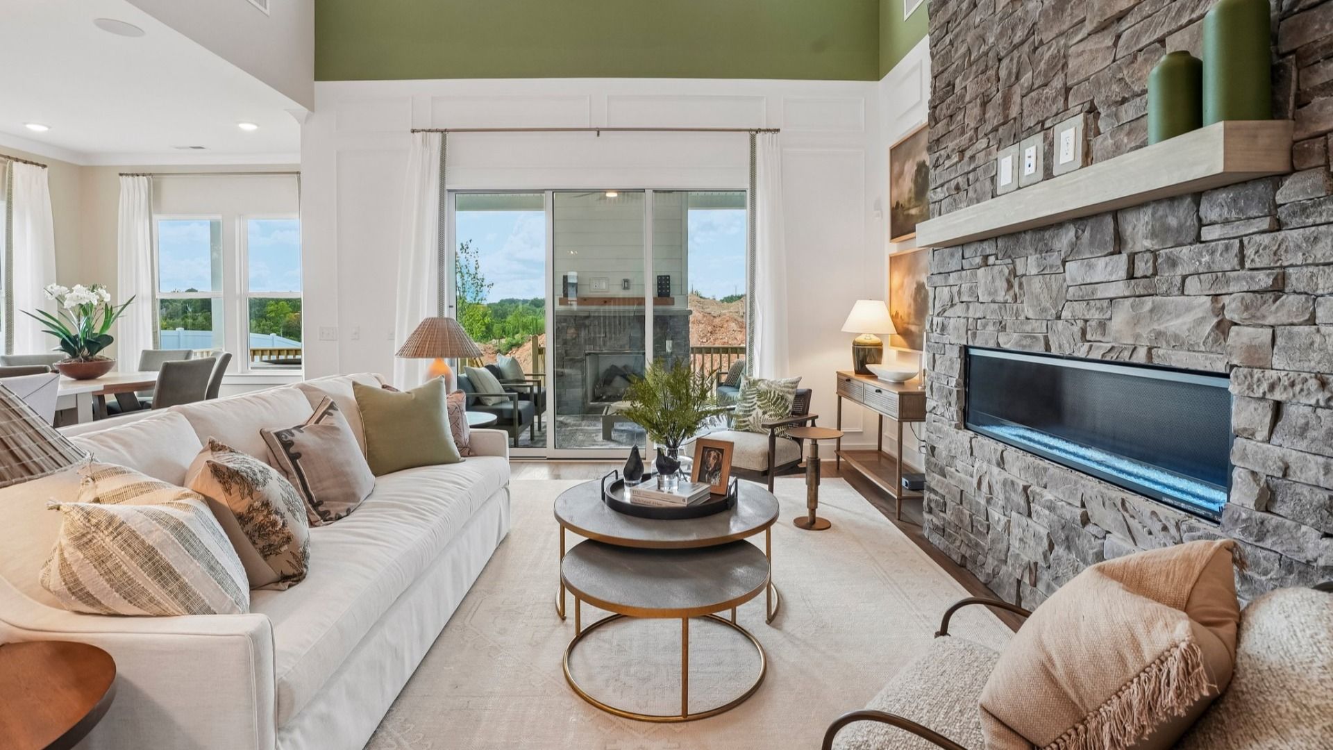 Gathering room with fireplace and access to rear patio
