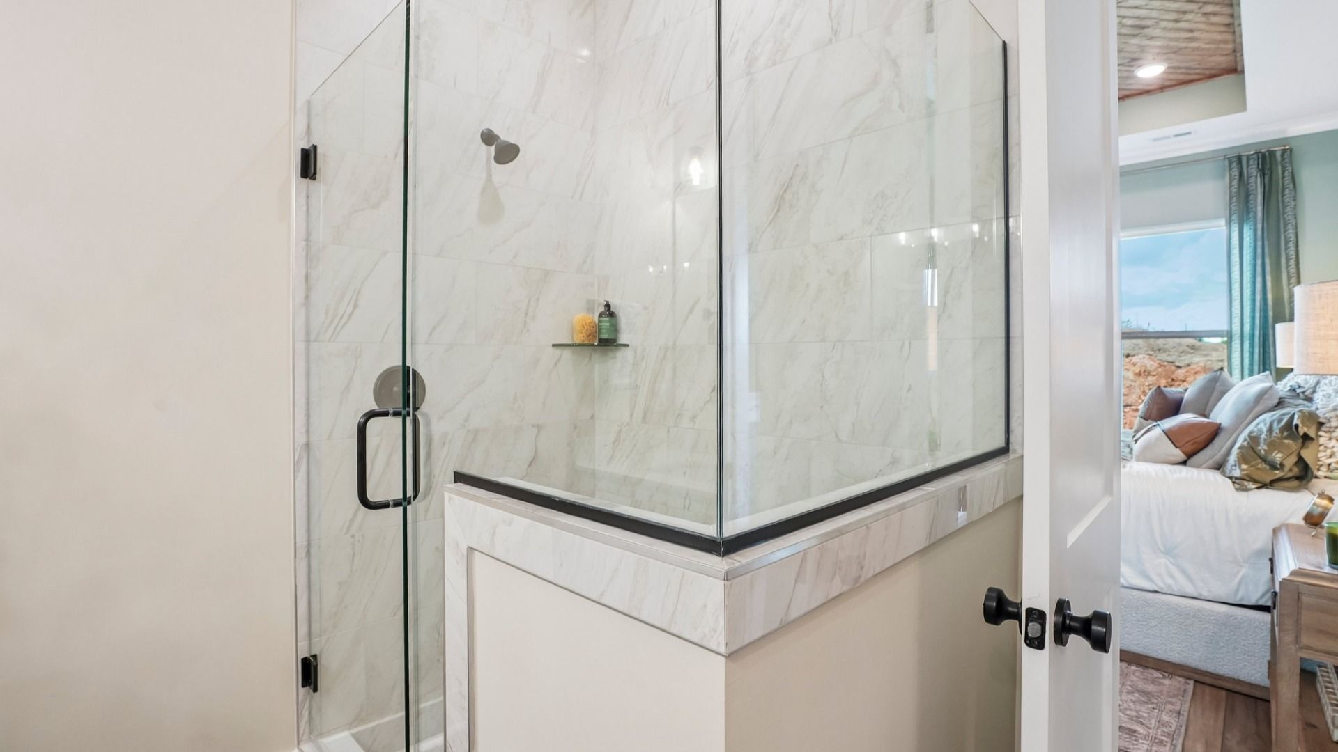 Primary bathroom with glass enclosed shower
