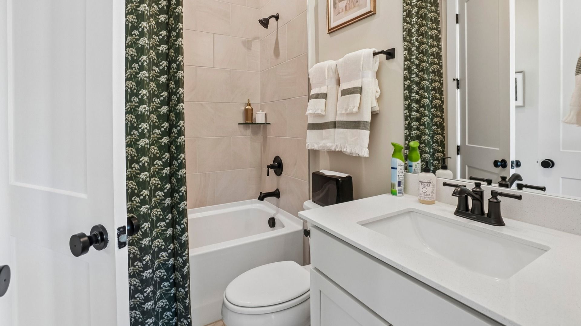 Secondary bathroom with tile lined shower