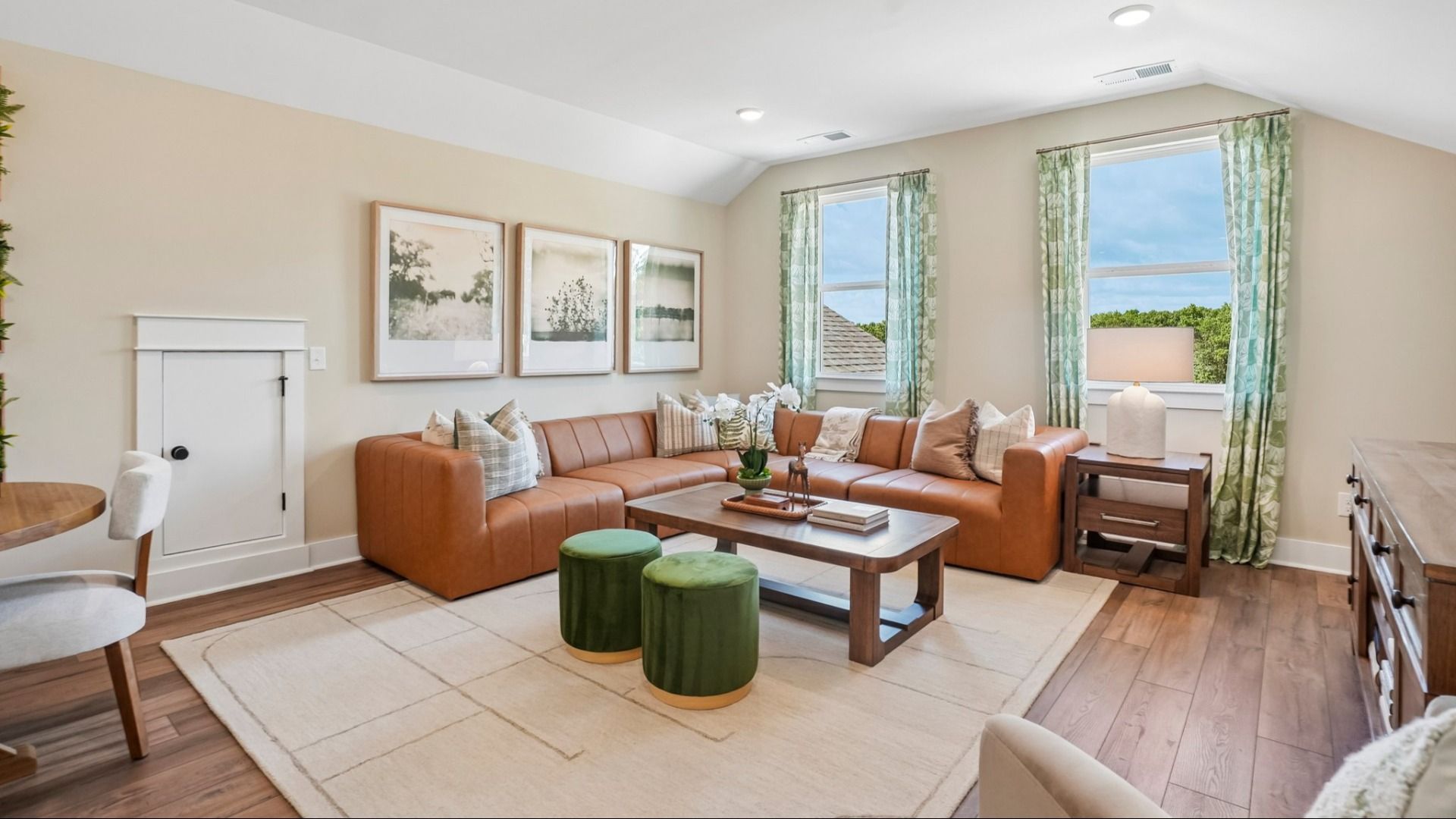 Spacious loft area with access to staircase and walkway to bedrooms