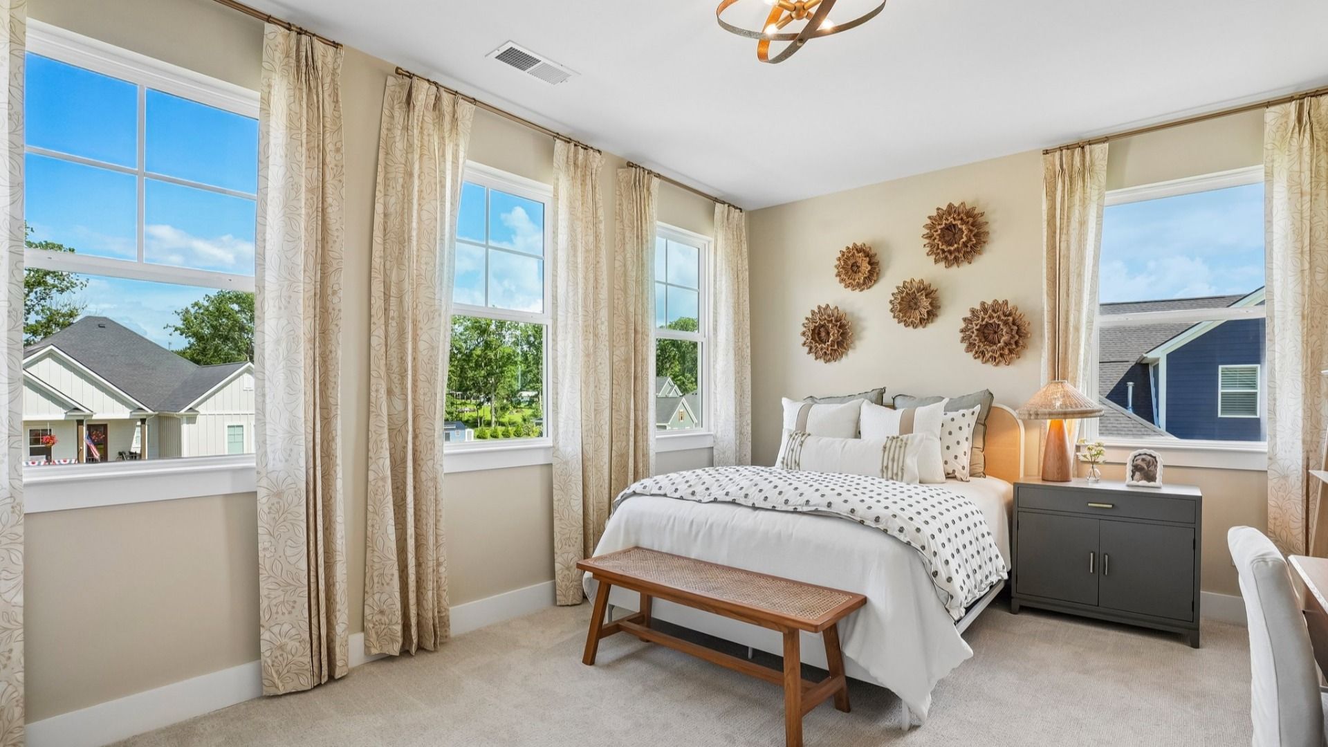 Secondary bedroom with carpet and windows