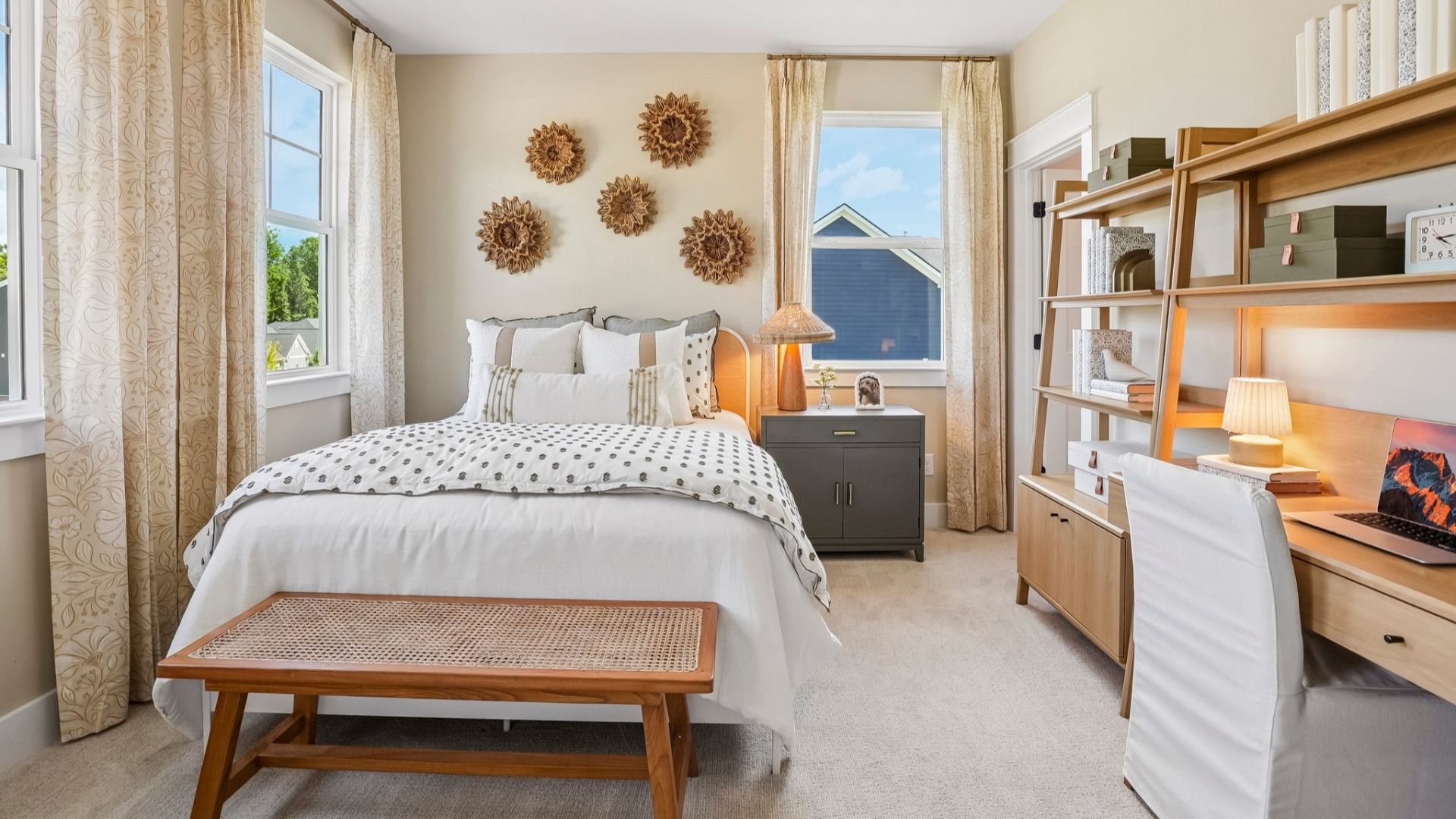 Secondary bedroom with carpet and windows