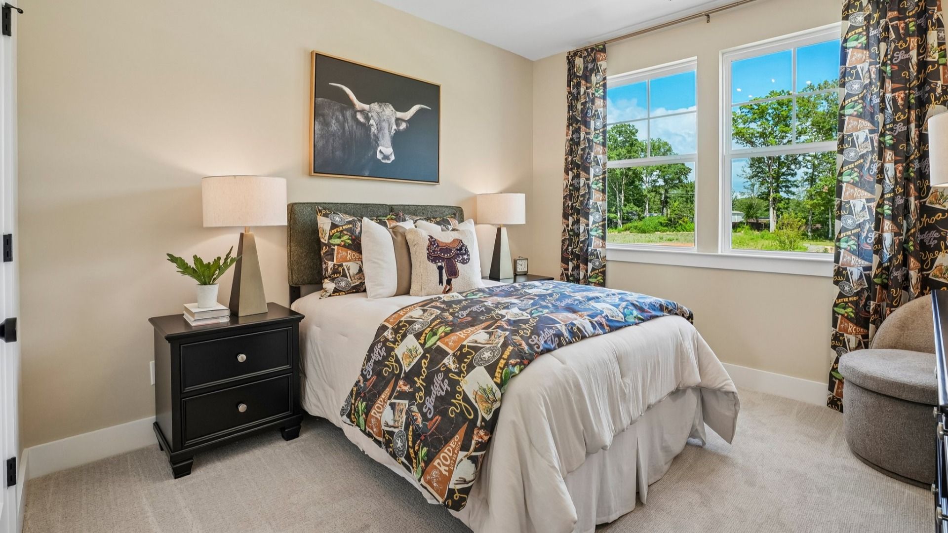 Secondary bedroom with carpet and windows