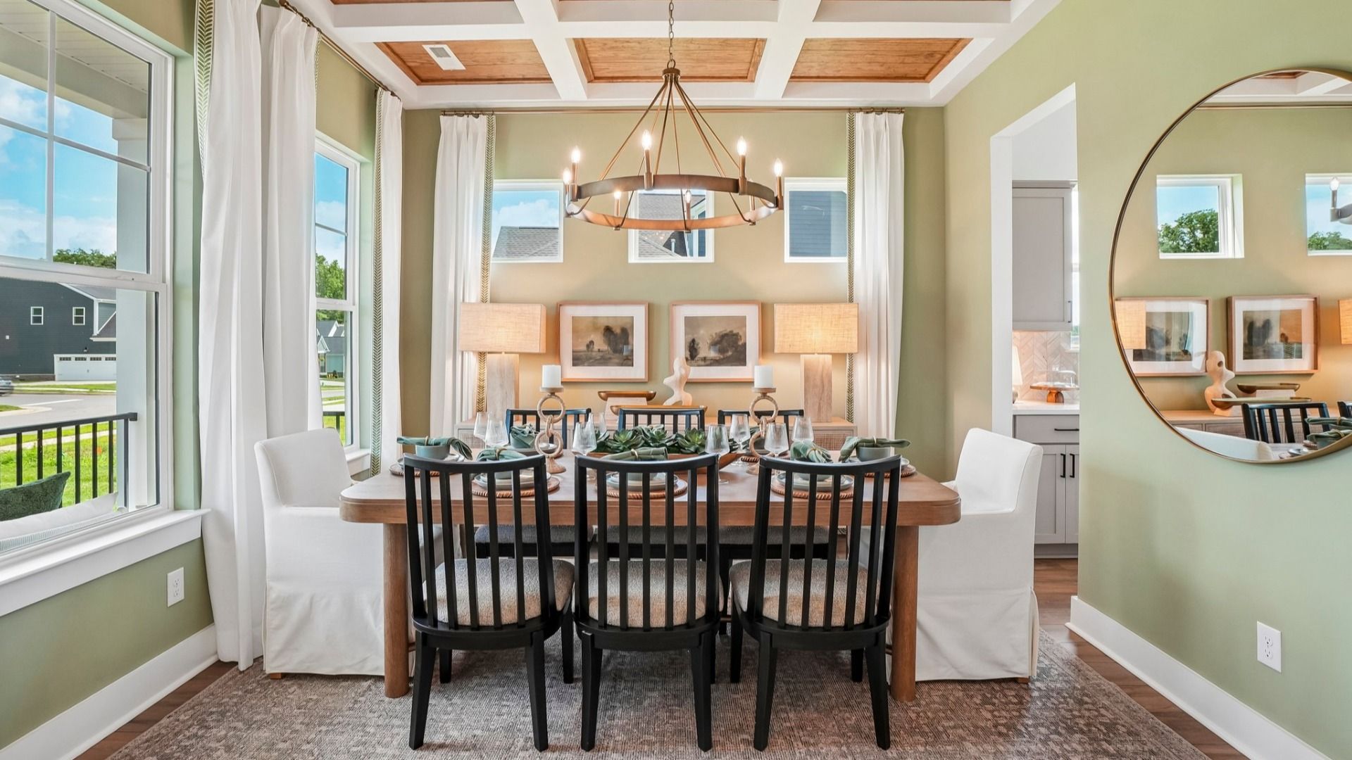 Dedicated dining room with coffered ceiling and access to kitchen