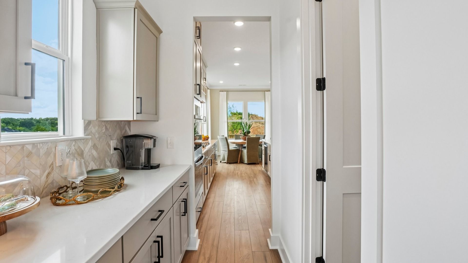 Portion of kitchen with additional counter space and access to walk-in pantry