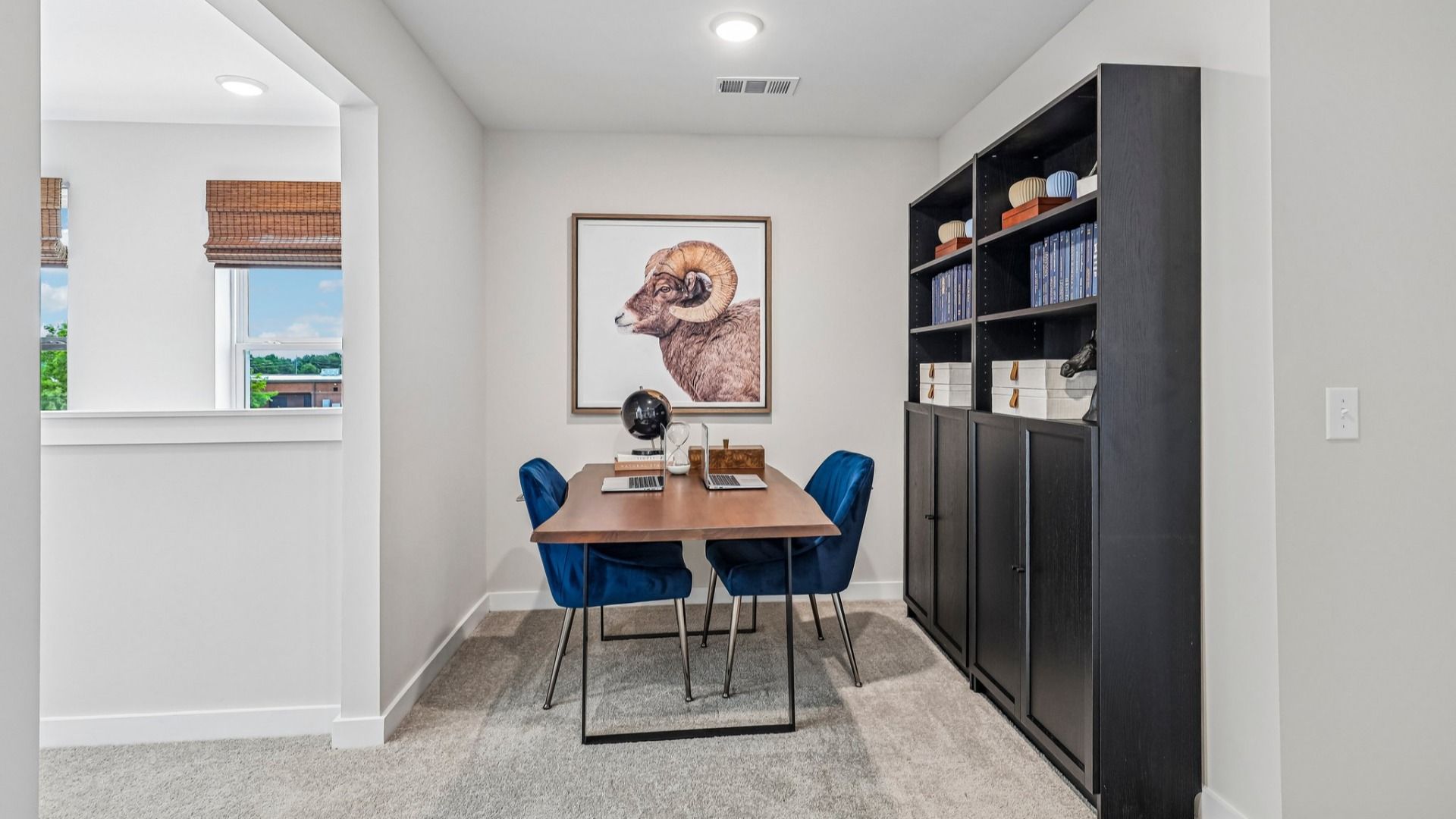 Spacious loft area with access to staircase and walkway to bedrooms