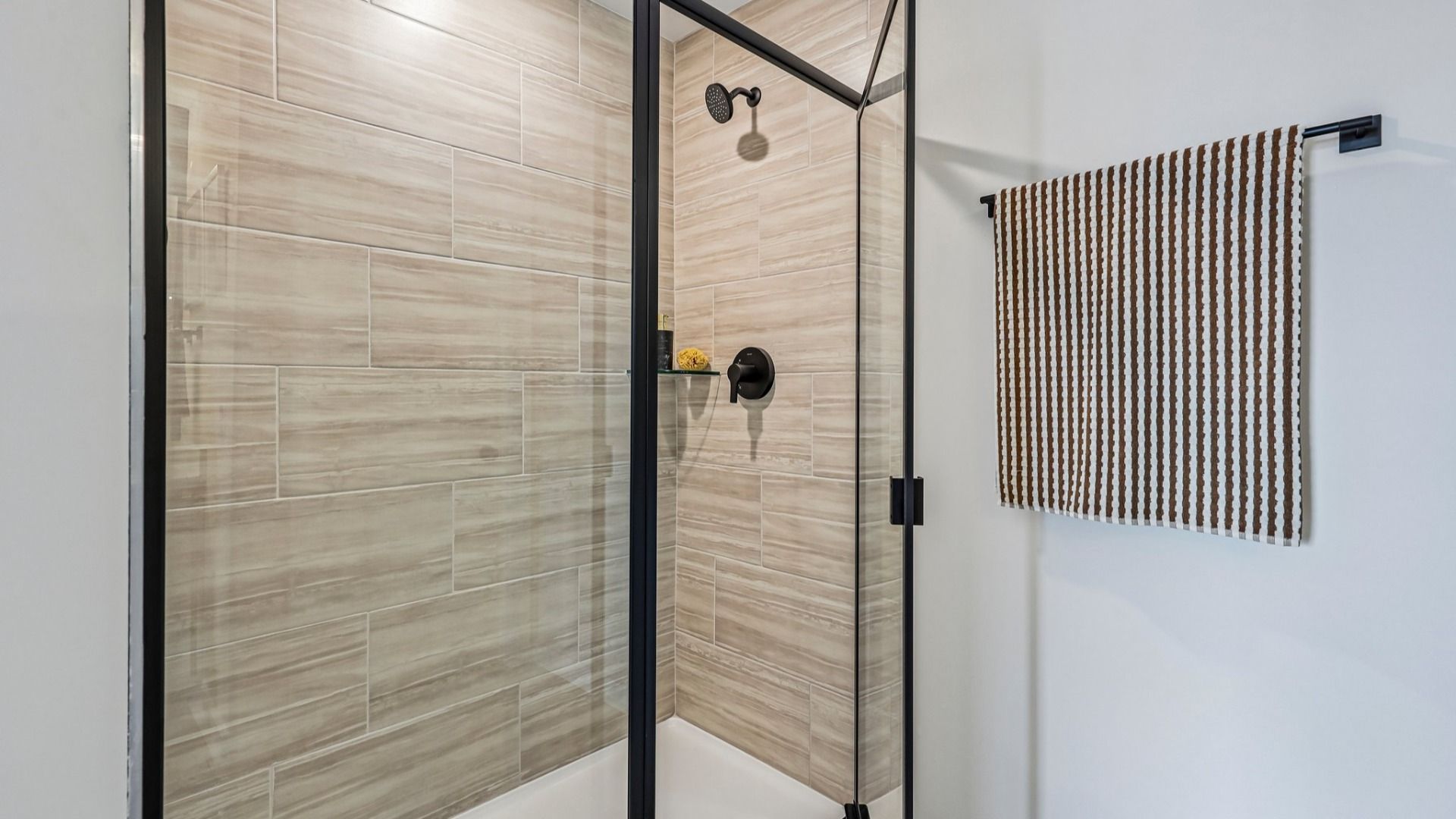 Primary bathroom with glass enclosed shower