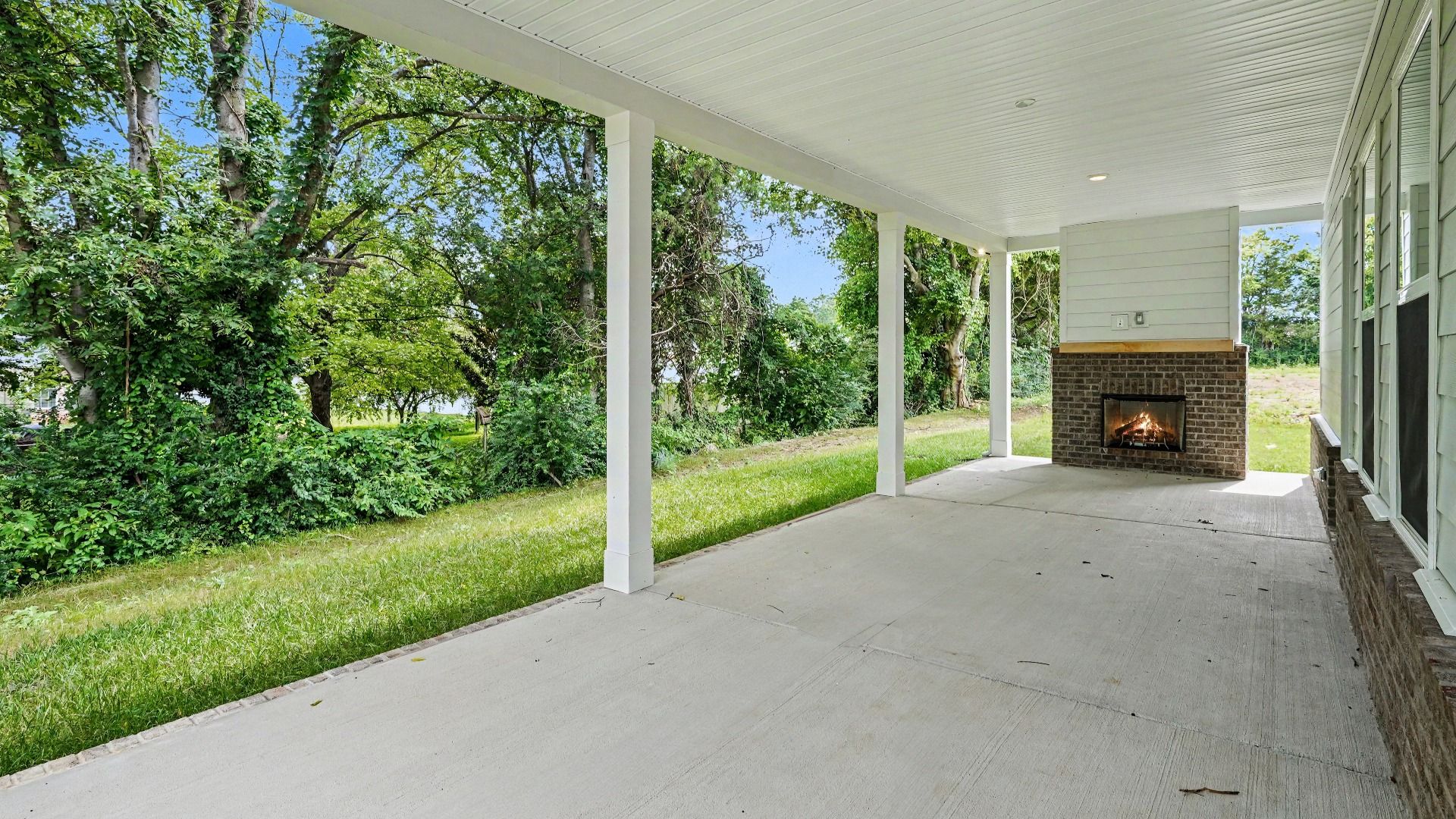 Covered rear patio with fireplace