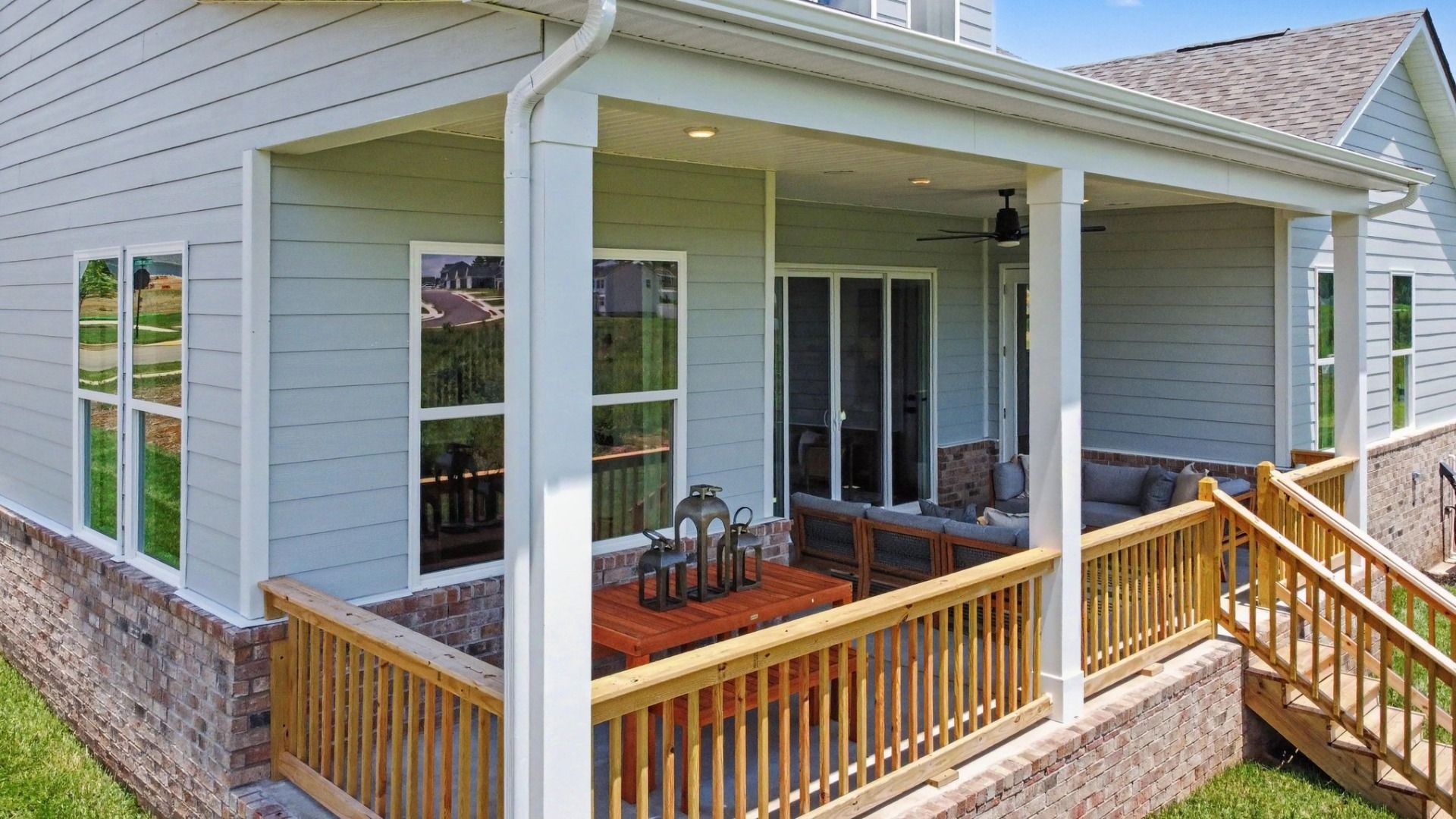 Spacious rear covered patio with ceiling fan