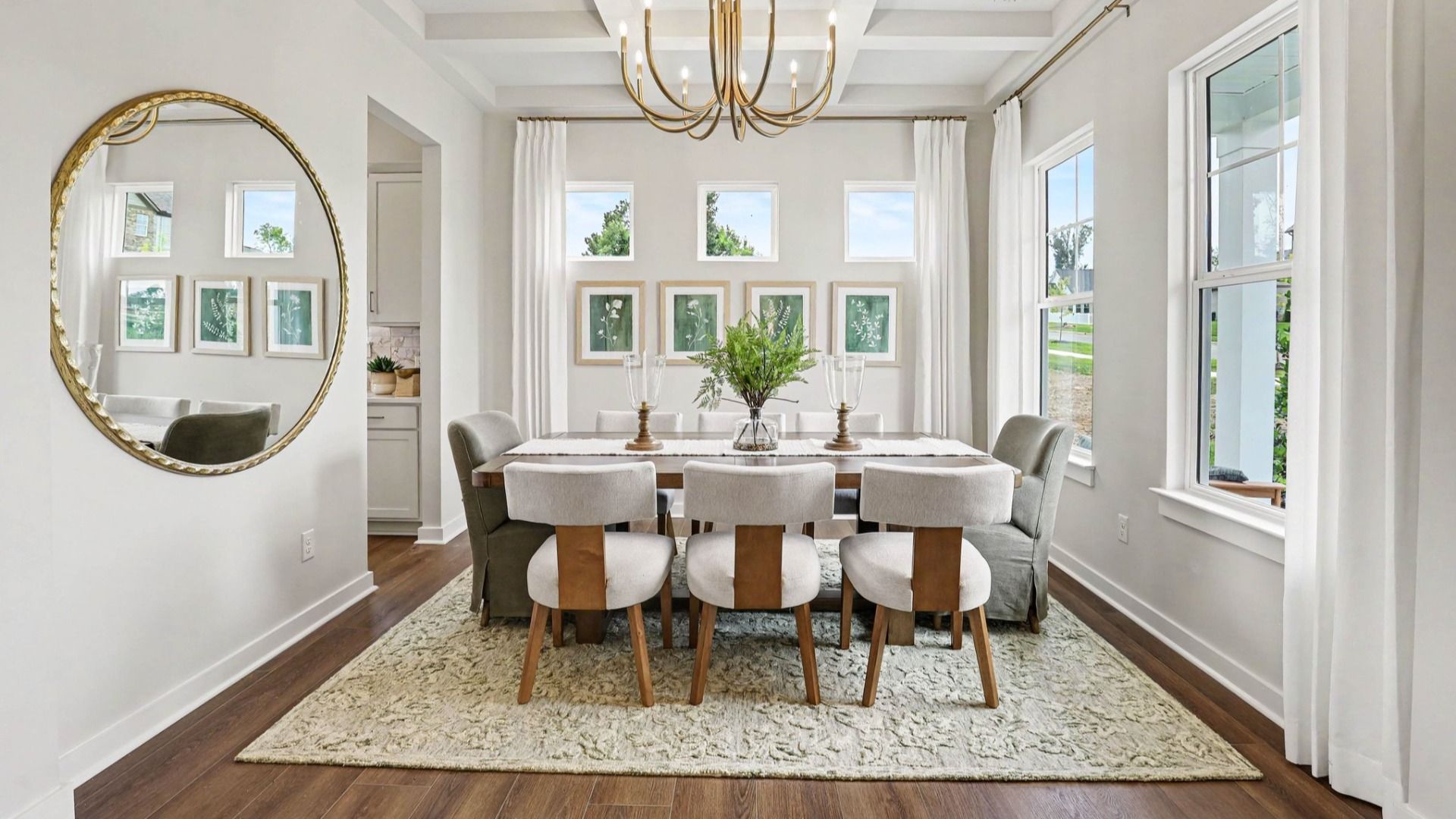 Dedicated dining room with natural lighting from windows and access to kitchen