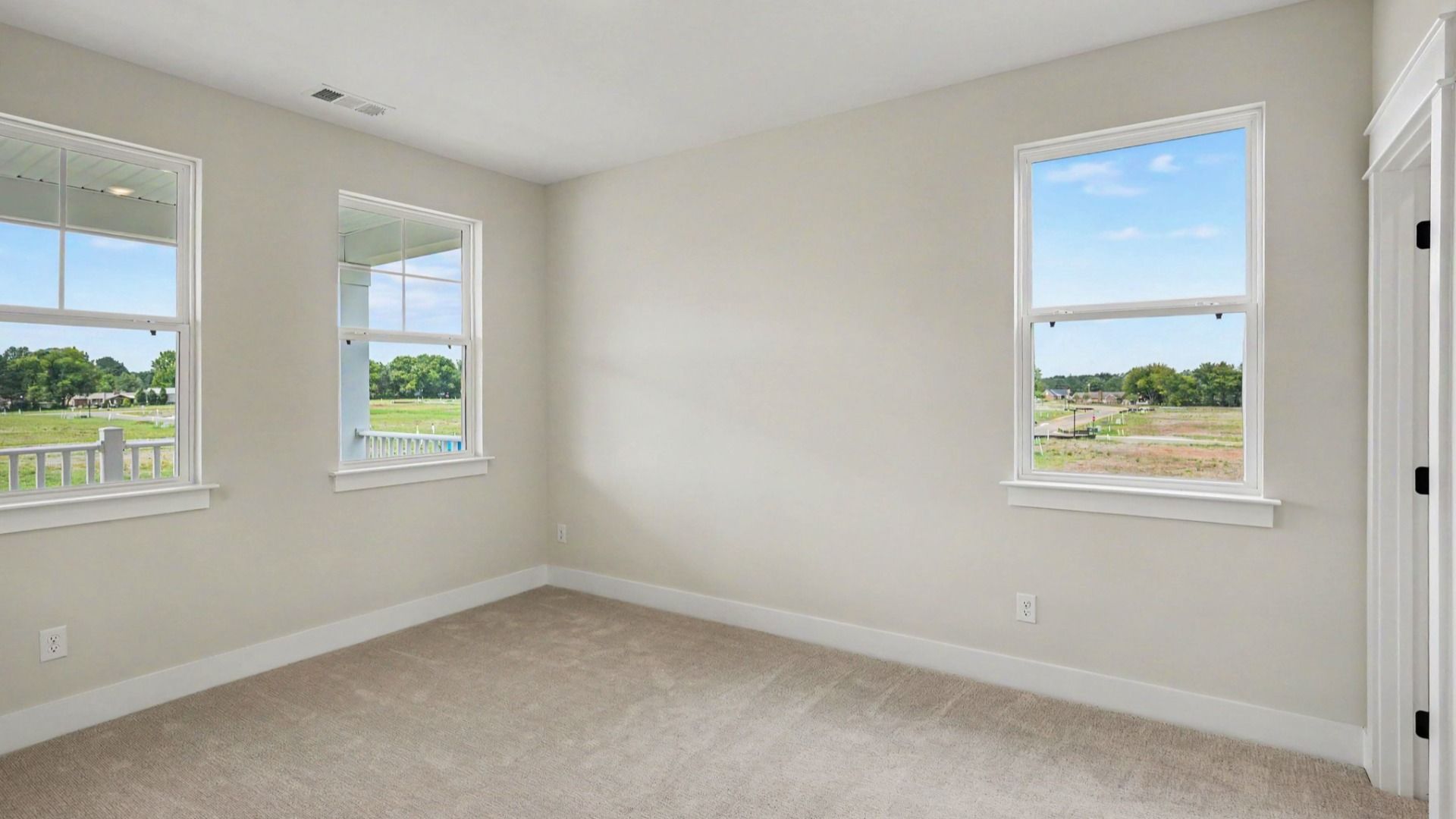Bedroom with carpet and windows