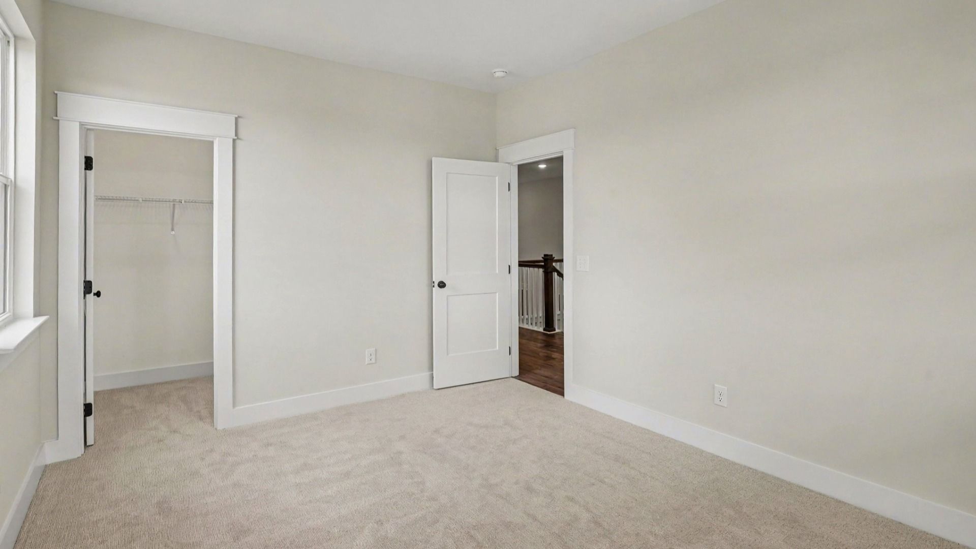 Bedroom with carpet and windows