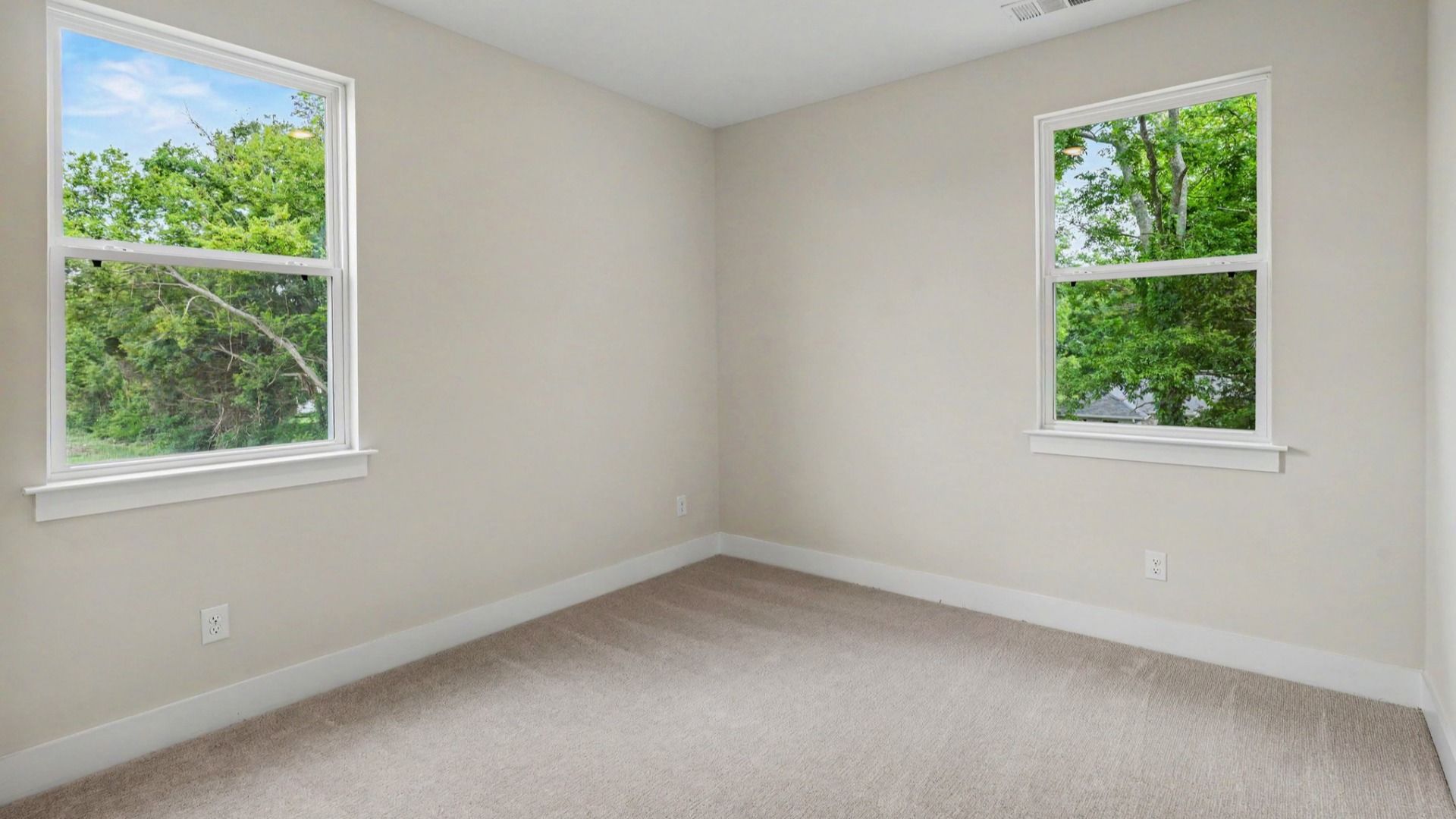 Bedroom with carpet and windows