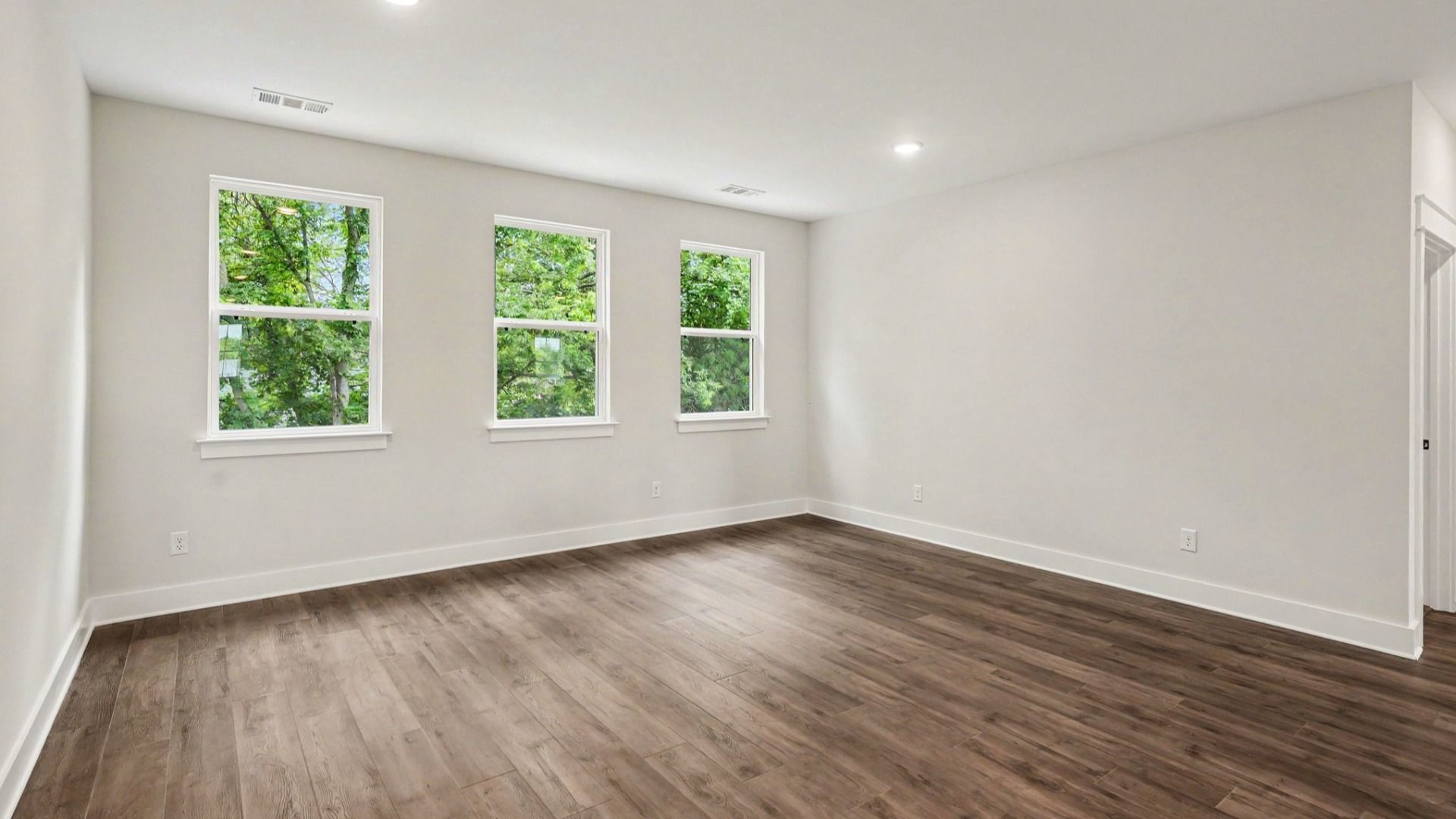 Flex space with windows and hard surface flooring