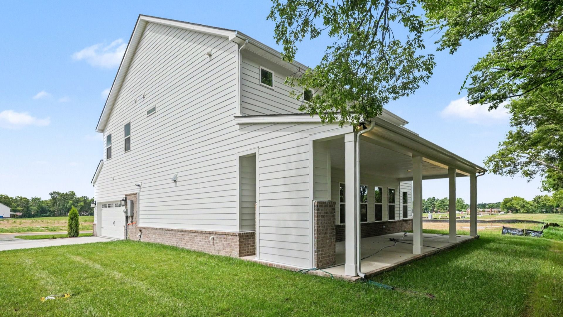 Front exterior with side view and side-load garage