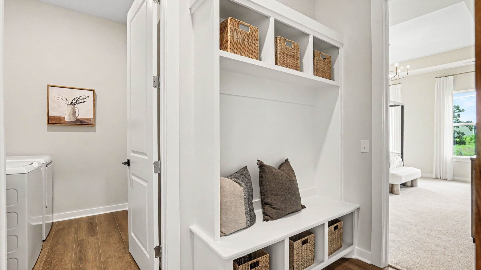Dedicated drop-zone with access to dedicated laundry room and primary suite