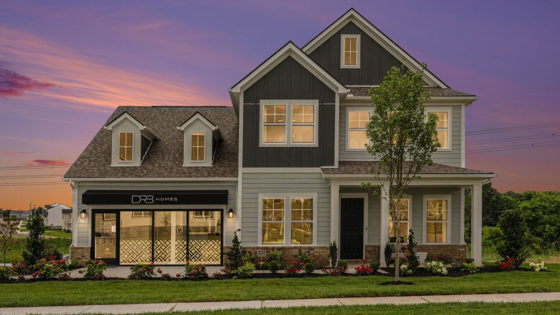 Front exterior of model home at dusk