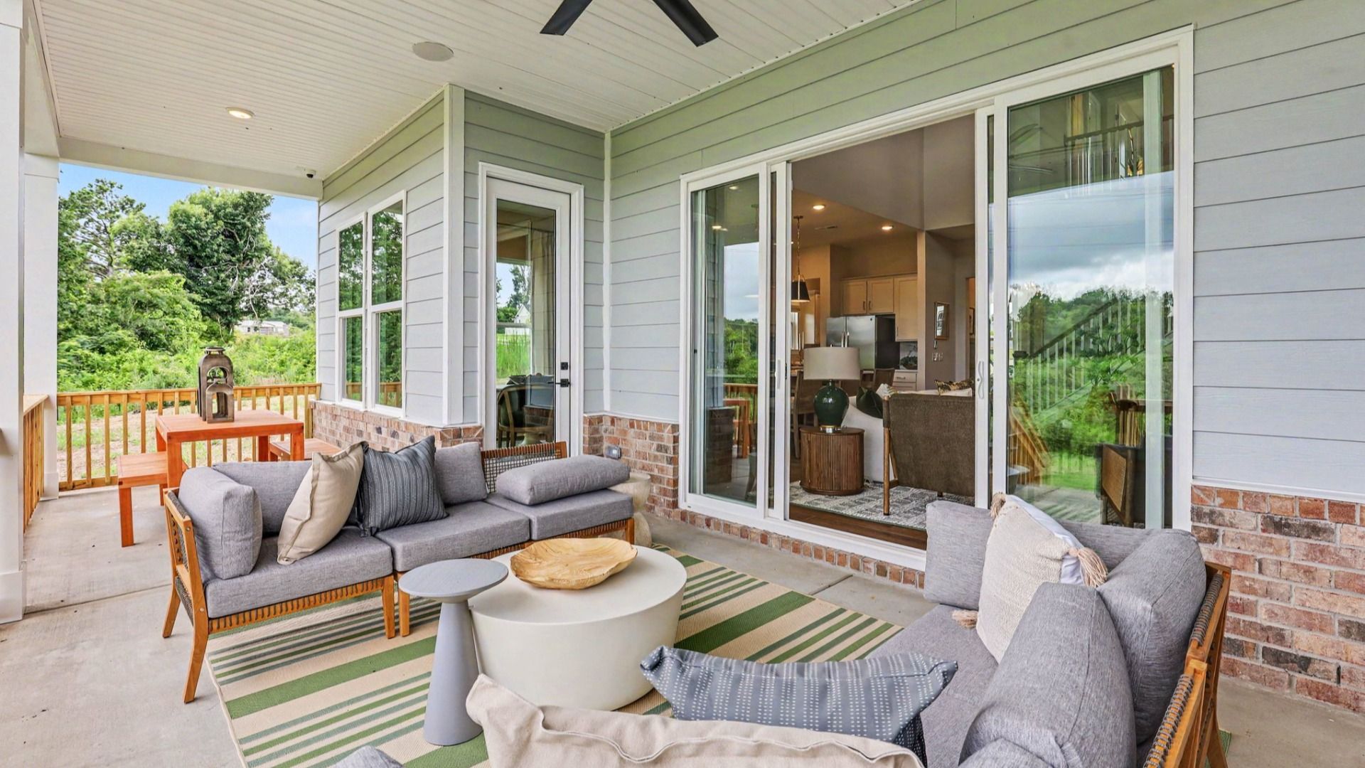 Spacious rear covered patio with ceiling fan