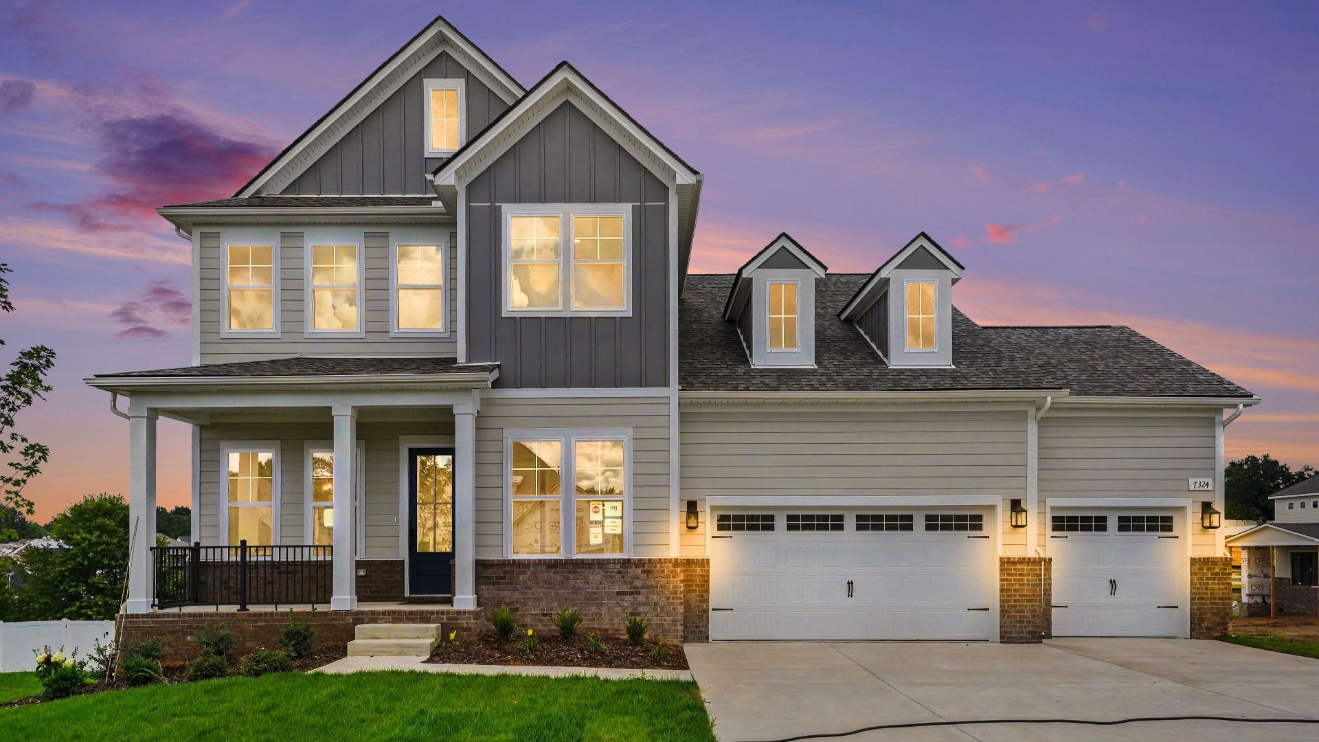 Front exterior with 3-car garage