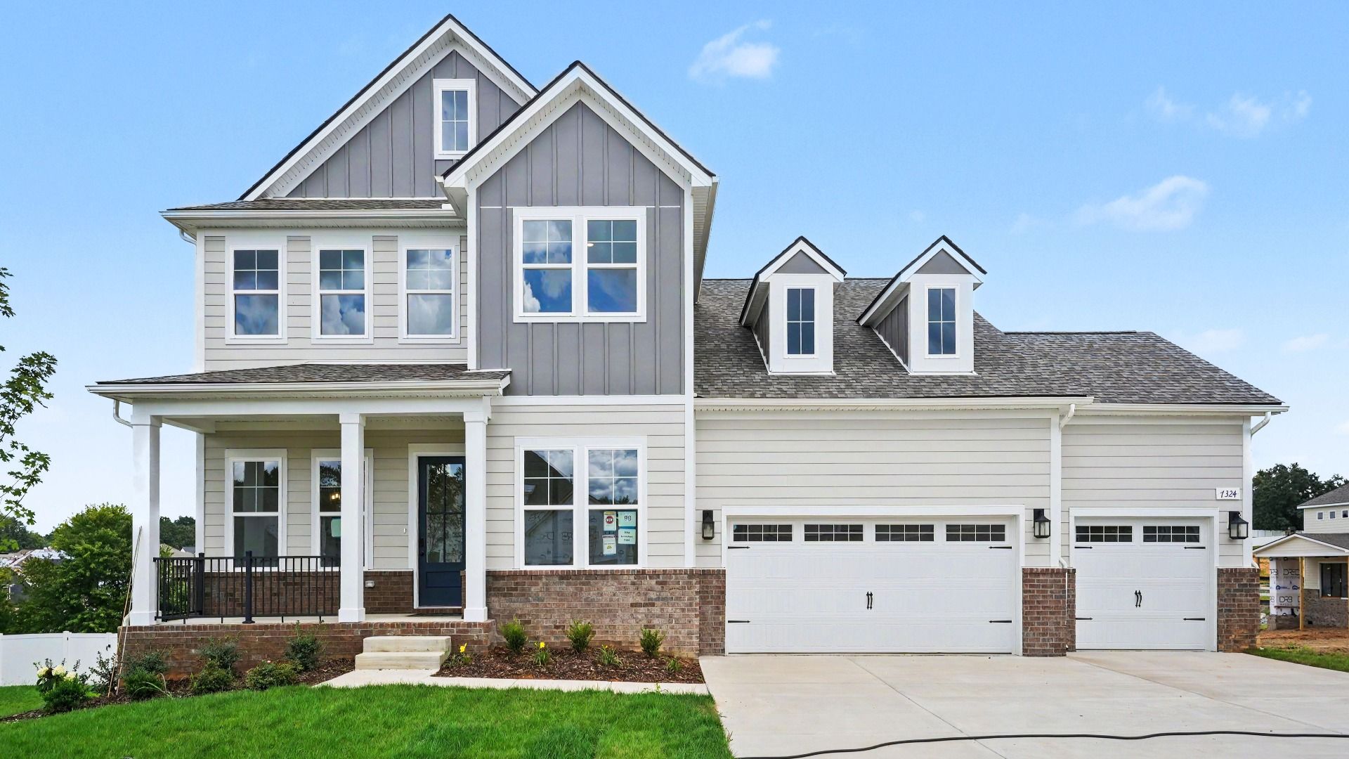 Front exterior with 3-car garage