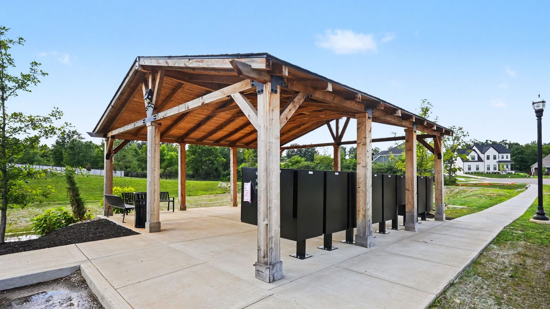 Pavilion over mail kiosk with sidewalks connecting to it