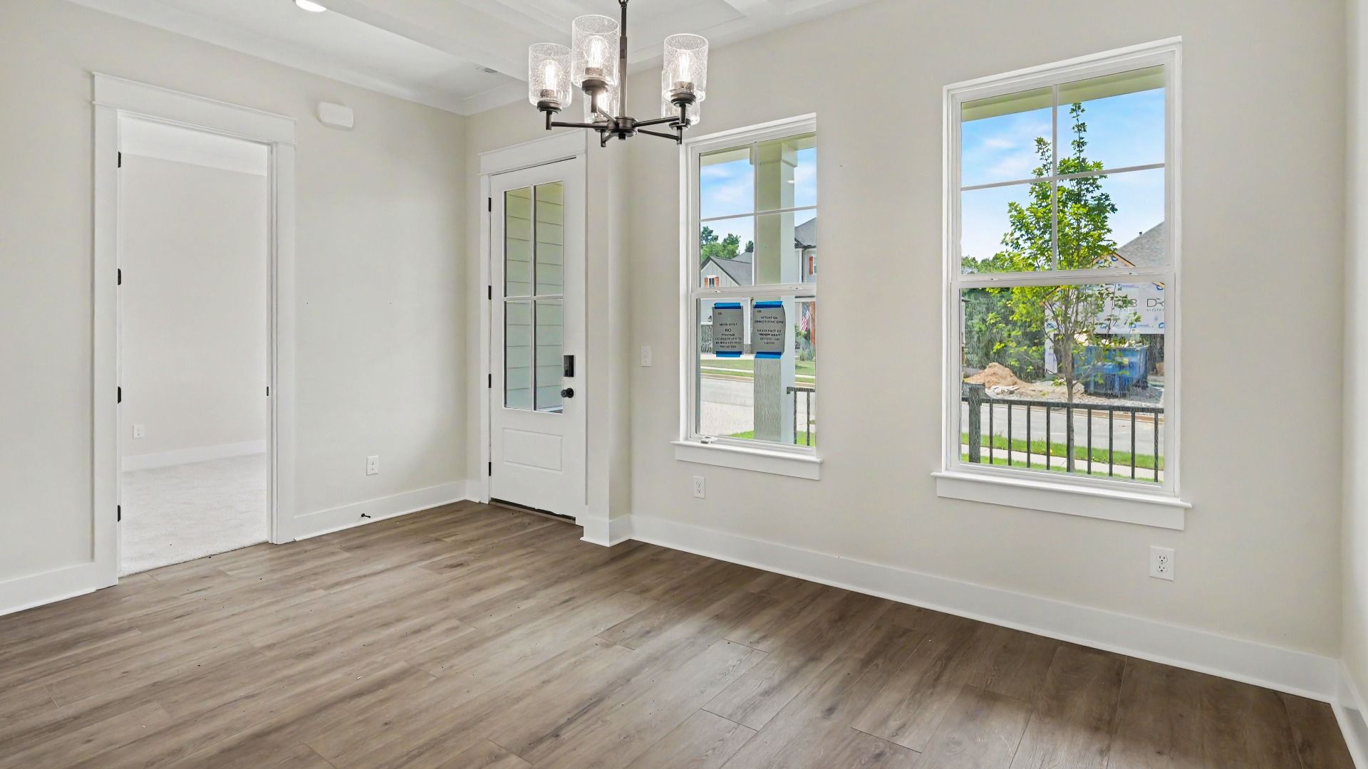 Dedicated dining area with windows and hard surface flooring